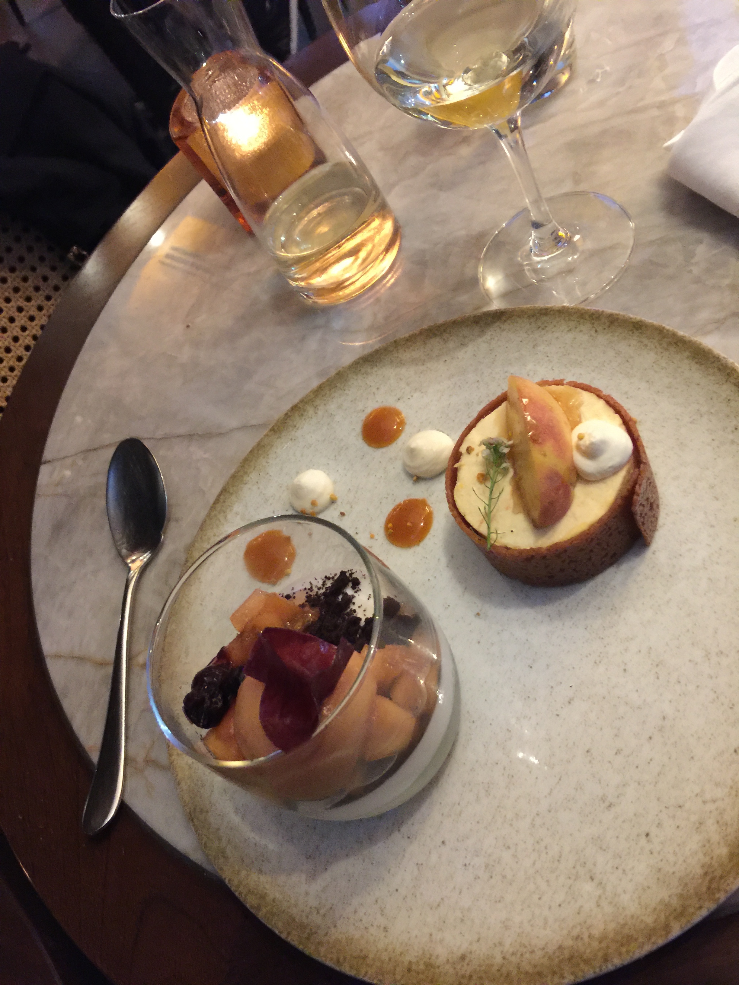 two deserts and a glass of wine