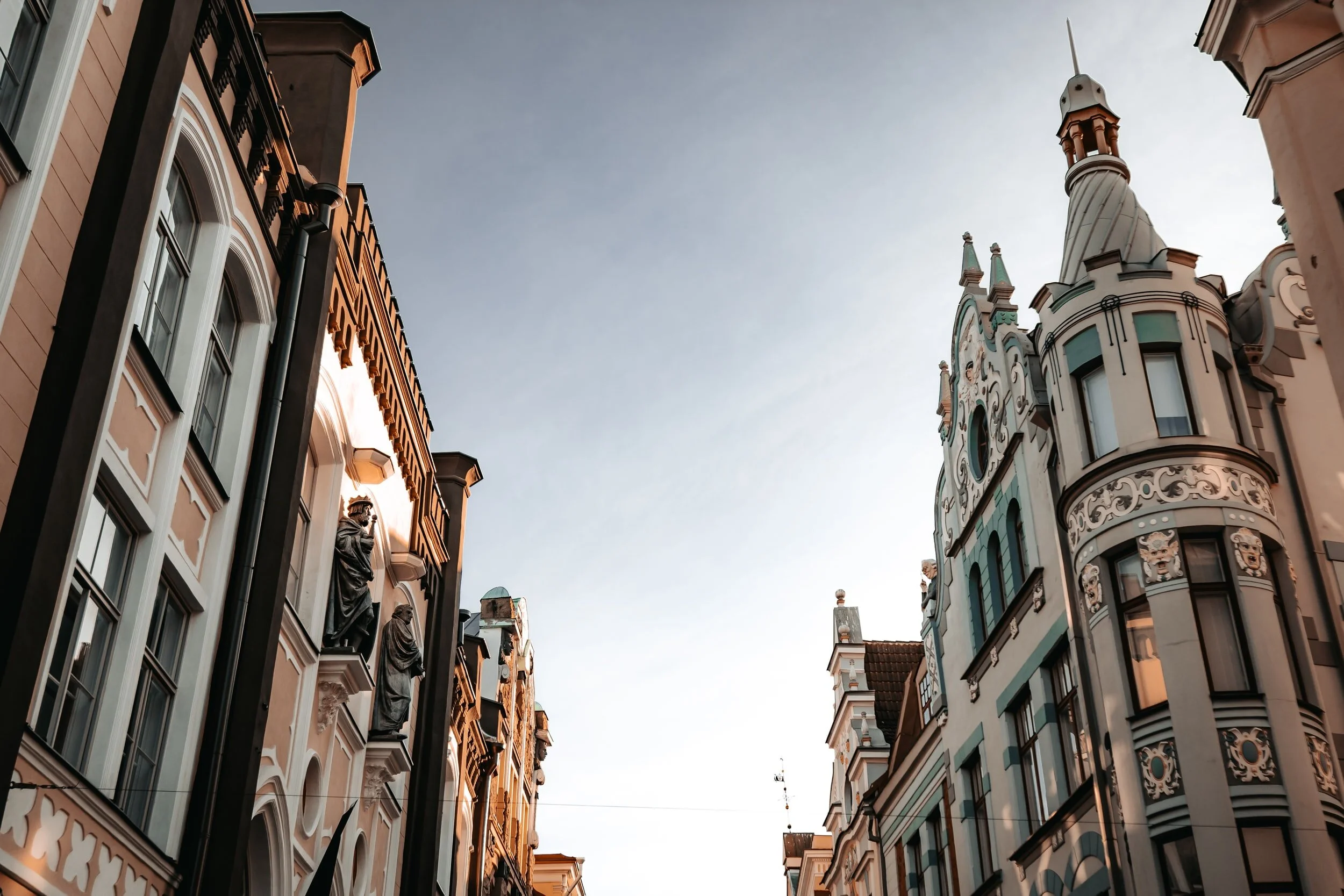Looking up at the beautiful old buildings in Estonia at sunset.