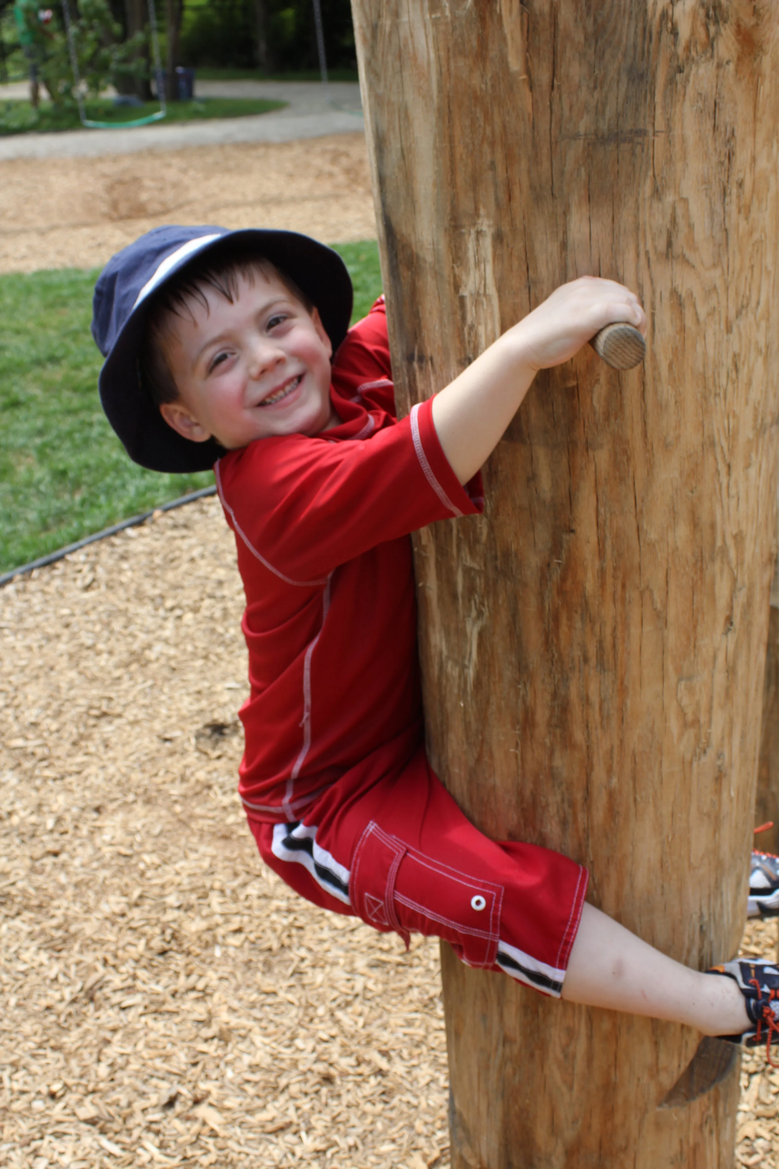 Hanging on - boy in red.JPG
