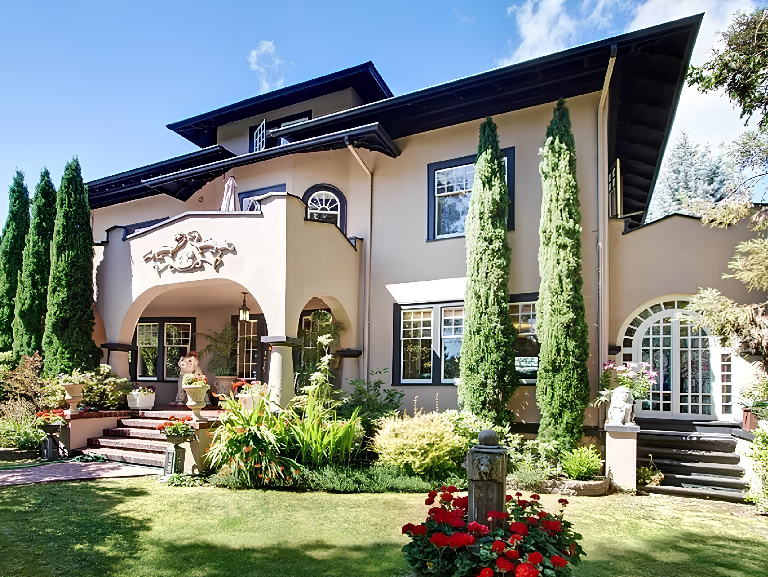 Multi-story home in Capitol Hill with landscaped front yard, mature trees, and covered porch