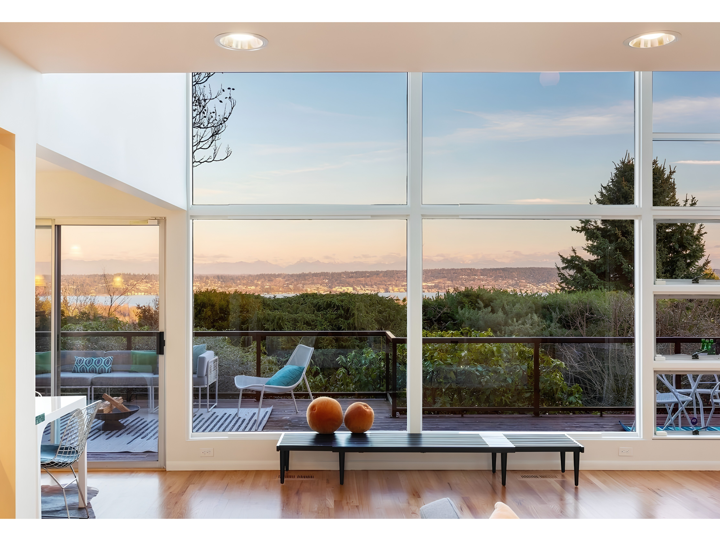 View Ridge living room with floor-to-ceiling windows and expansive water and territorial views