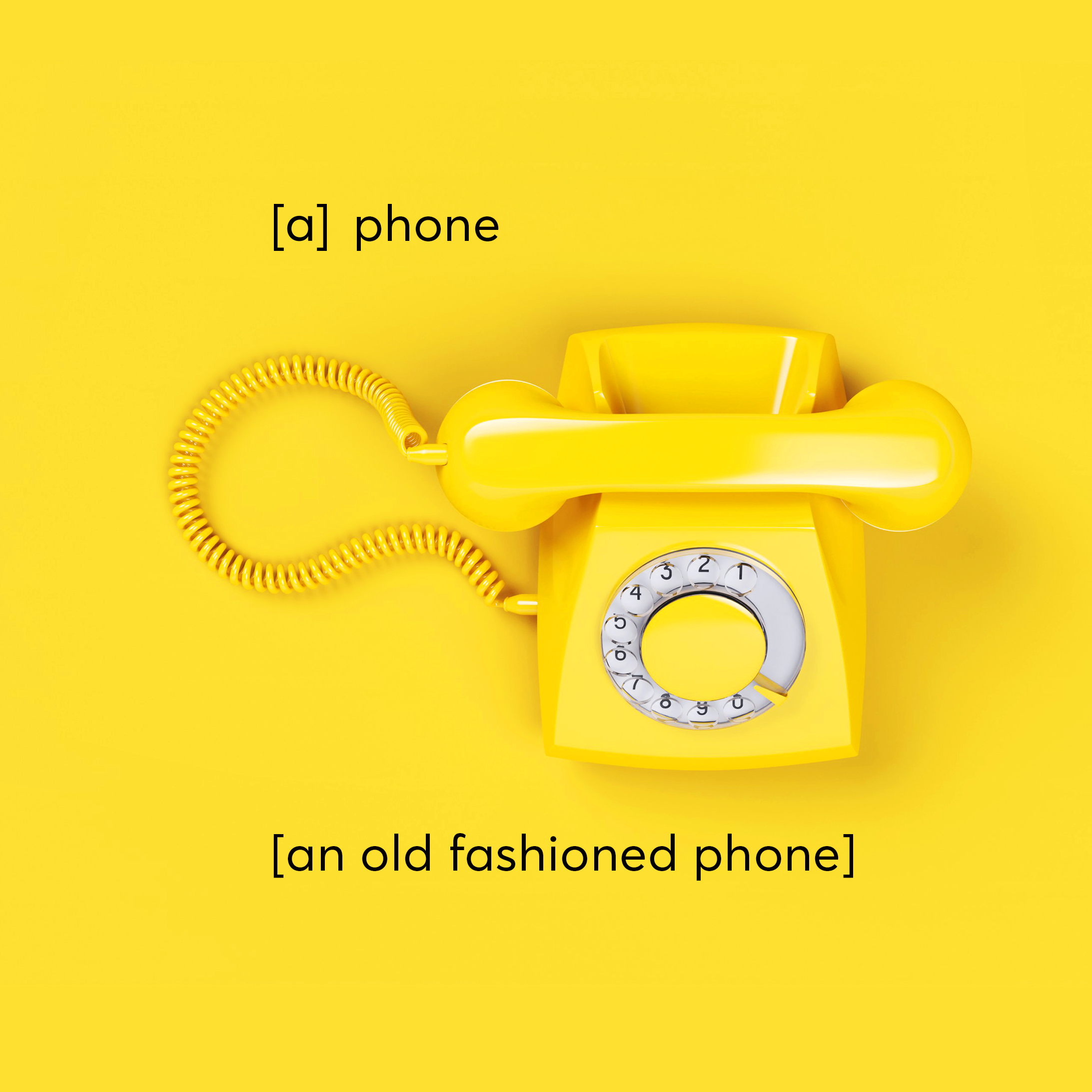 A photograph of a landline phone. Overlay text reads, "[a] phone. [an old fashioned phone.]