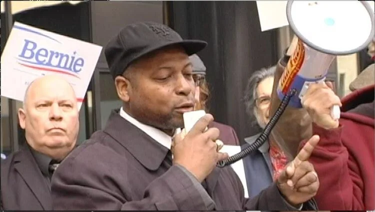 Albany County Legislator Mert Simpson speaks during a rally for Bernie Sanders outside the New York State Board of Elections office in Albany on Thursday, Feb. 4. NYSNYS News Photo