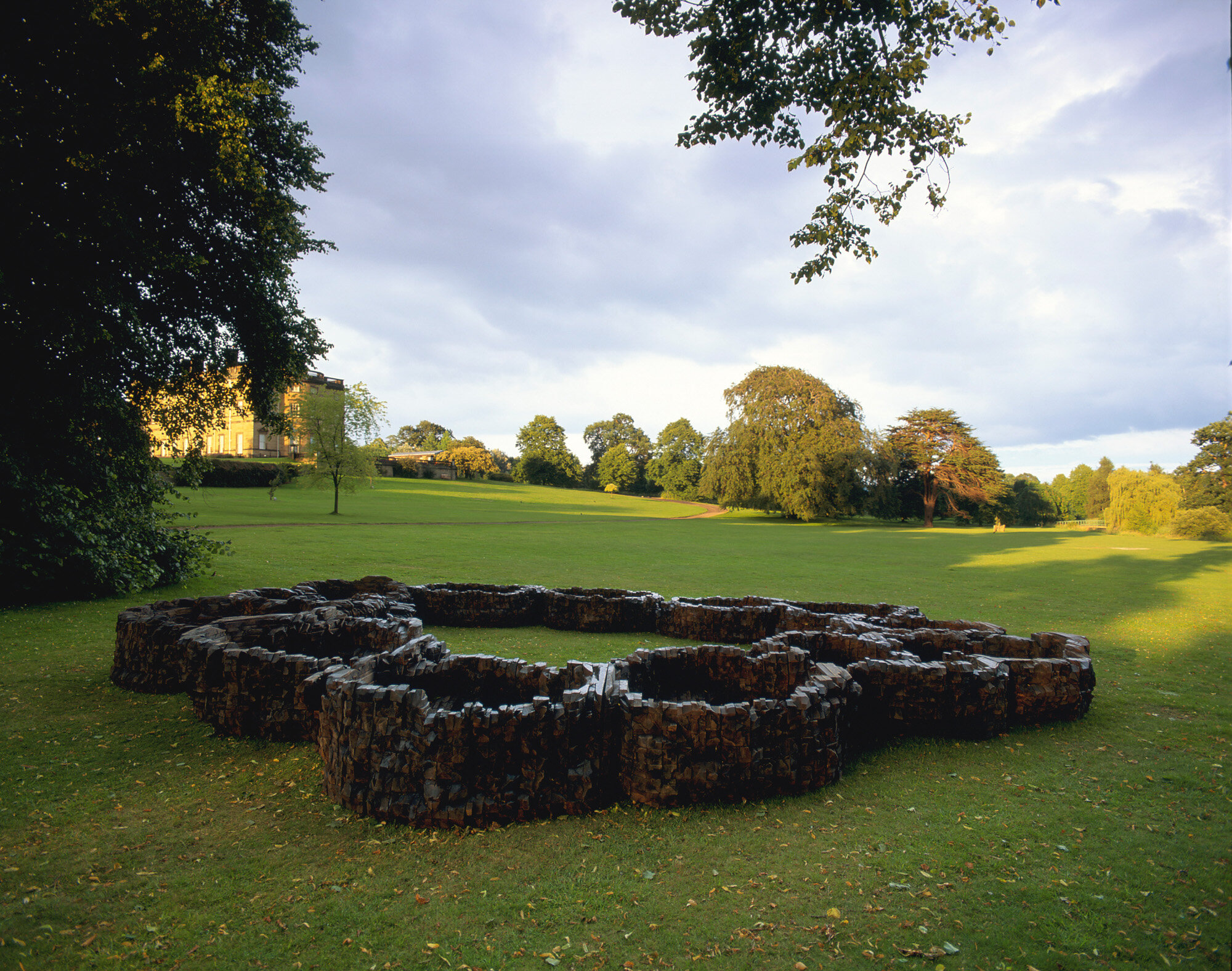       Hand-e-over , 1996 Cedar and graphite 32 x 288 x 396 in.    Yorkshire Sculpture Park  