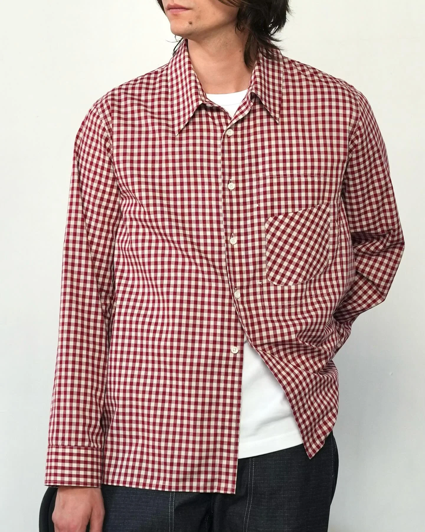 Our Harvest Shirt draws from historic working-class garments, blending practicality with heritage. It features utilitarian chest pocket details and is offered in a gingham fabrication&mdash;once popular in America for its affordability and associatio