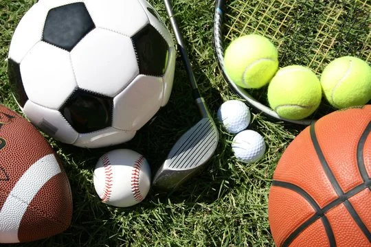 A collection of sports equipment representing athletic trauma recovery and sports injury rehabilitation at Indy Spine and Rehab in Carmel, Indiana.