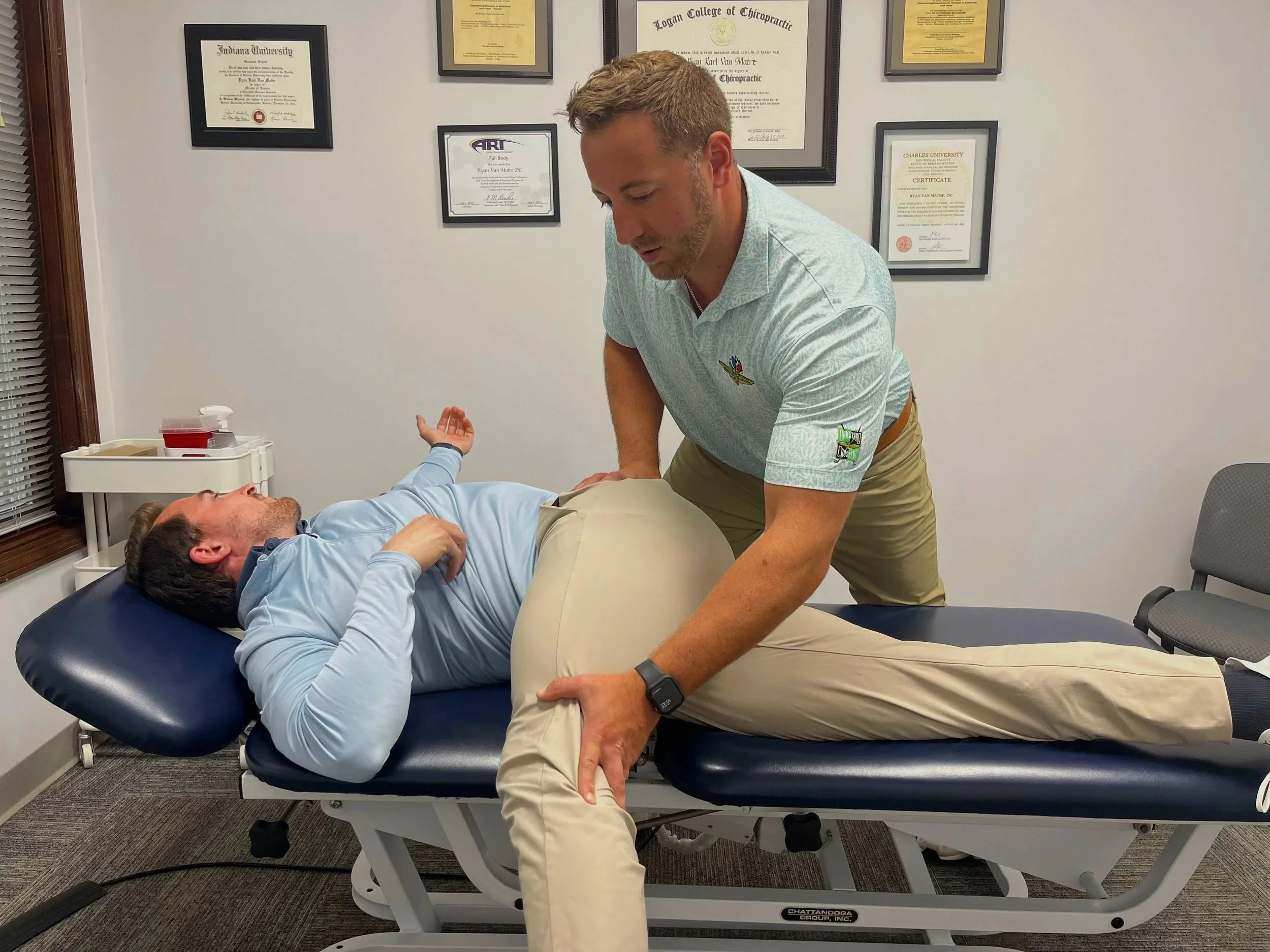 Dr. Alex Sarpa providing functional movement assessments at Indy Spine and Rehab clinic.