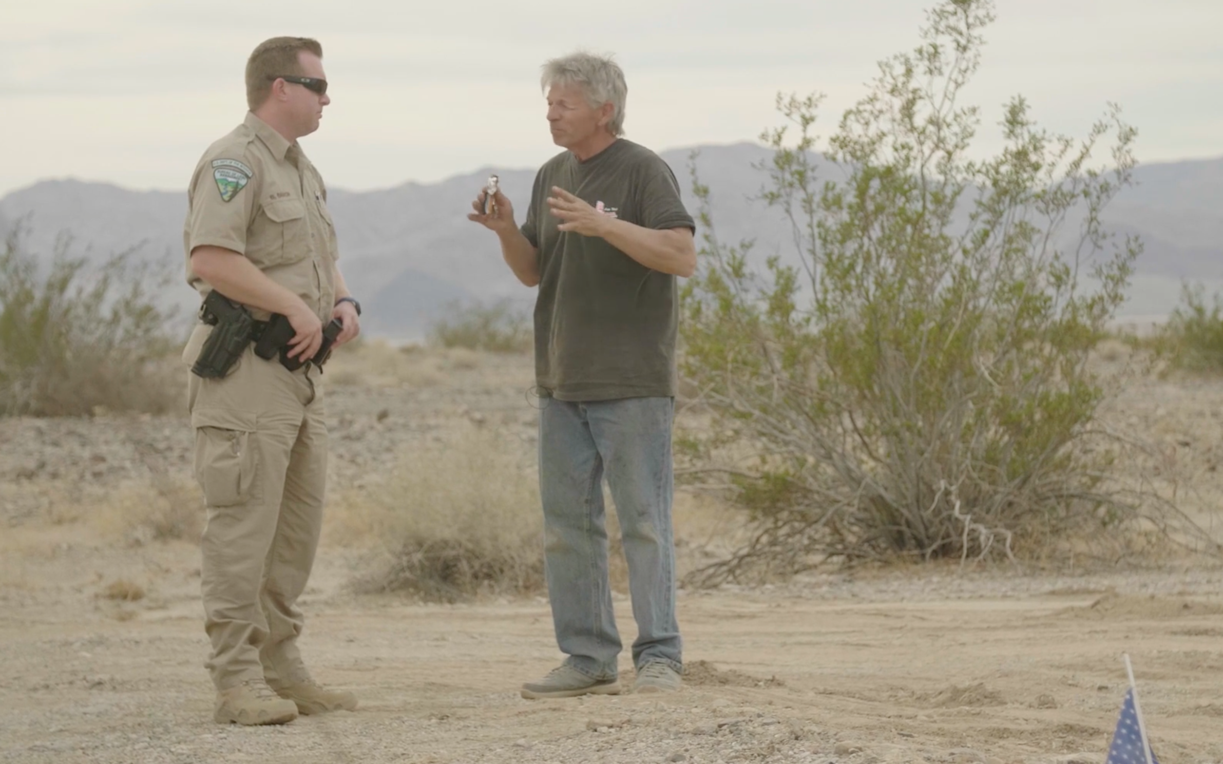 Chief BLM Ranger Brad Baron listens to 'Mad Mike' talk about the rocket launch.