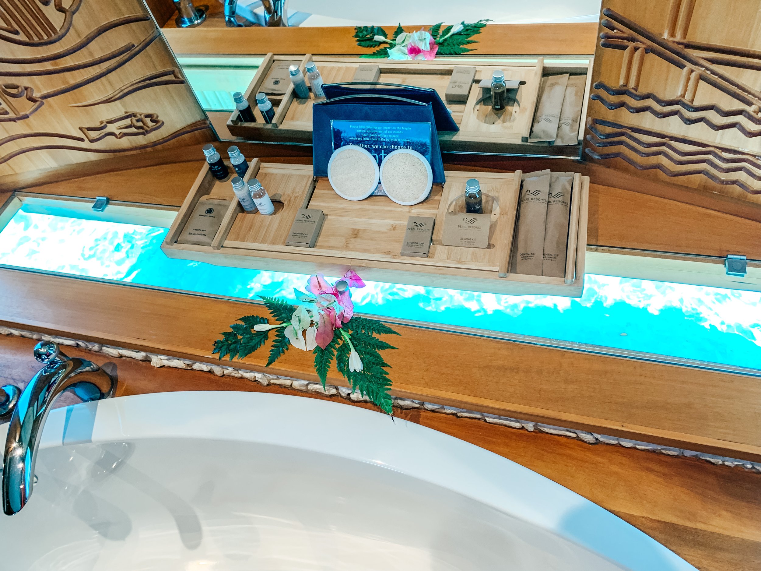 Bathtub at water view at Le Taha'a by Pearl Resorts