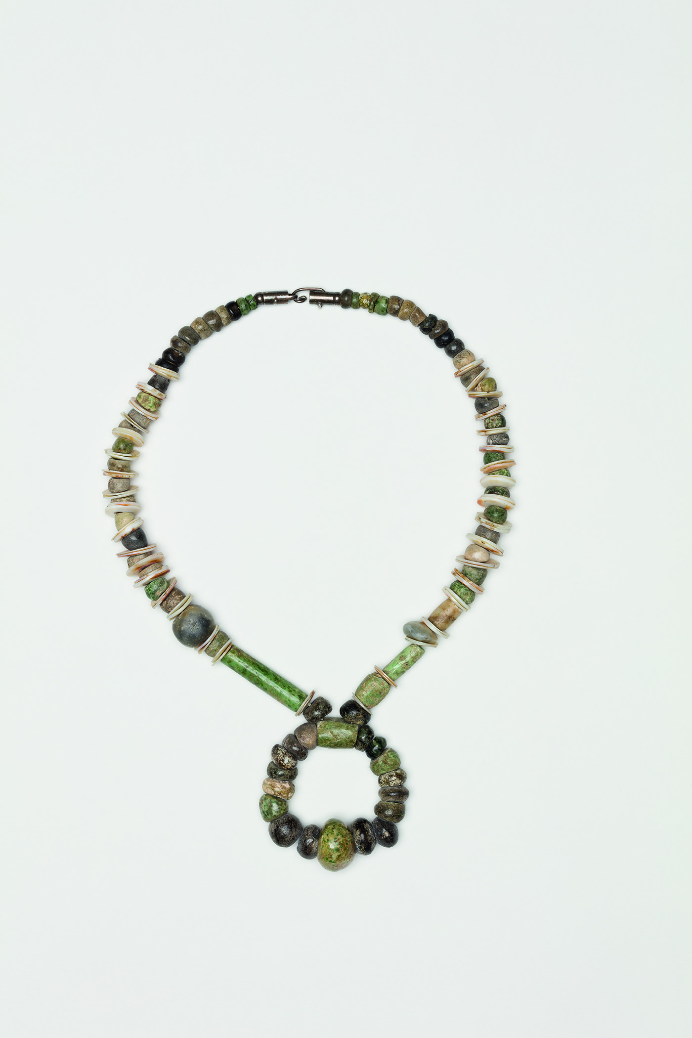   Untitled , 1985  Shells, jade, pre-Columbian beads, silver clasp  13 1/2 x 1 inches  34.29 x 2.54 cm 