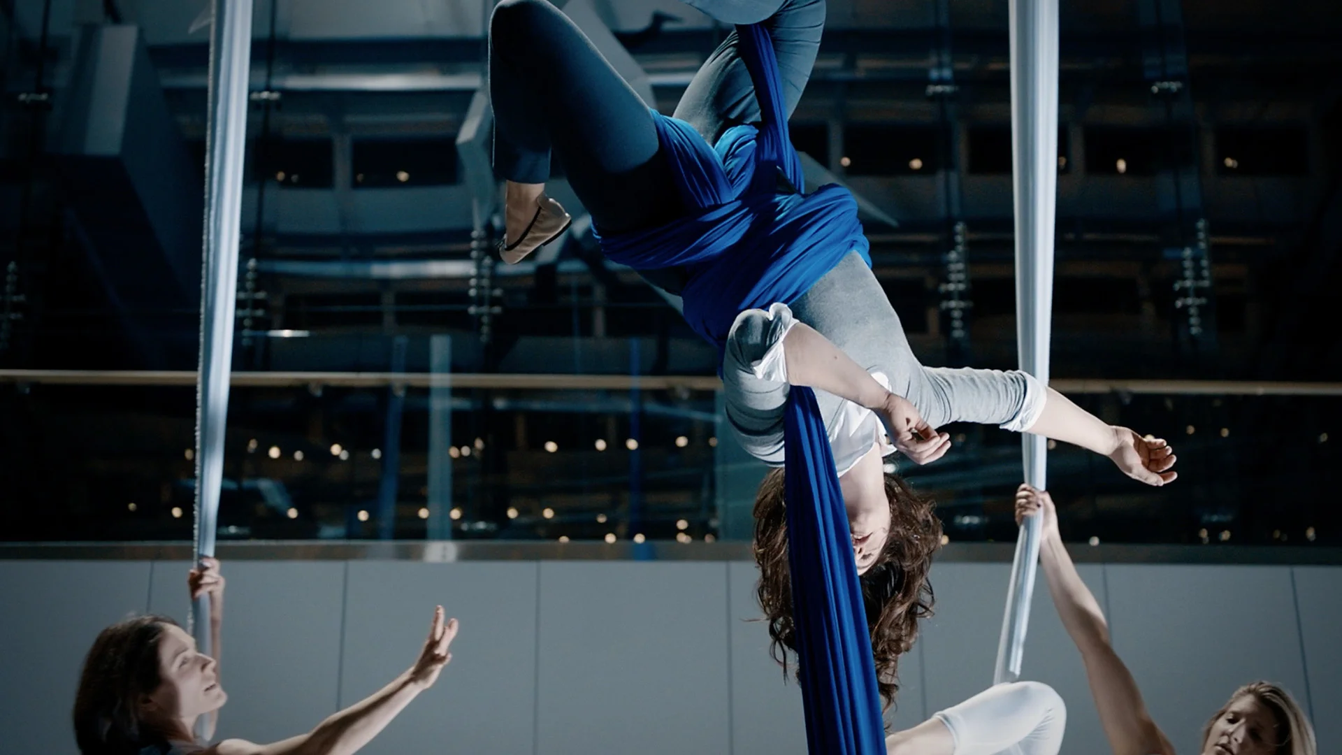    Aerialists use the Blue Ribbon of Colorectal Cancer Awareness in their choreography.    