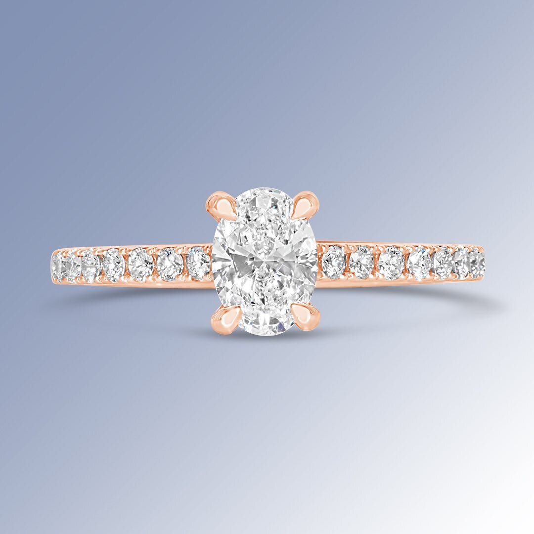 As a color rose gold communicates luxury, the soft tones and curves of this oval diamond ring brings it to life.