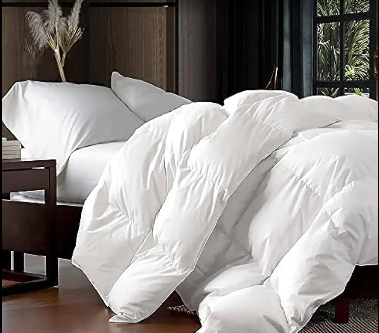 White down comforter on bed - Sterling Fine Cleaning linens and bedding cleaning Los Angeles