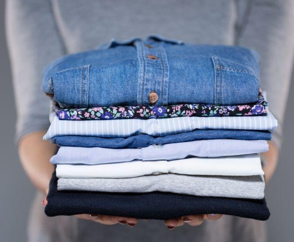 Neatly folded stack of clean laundry - Sterling Fine Cleaning wash and fold service Los Angeles