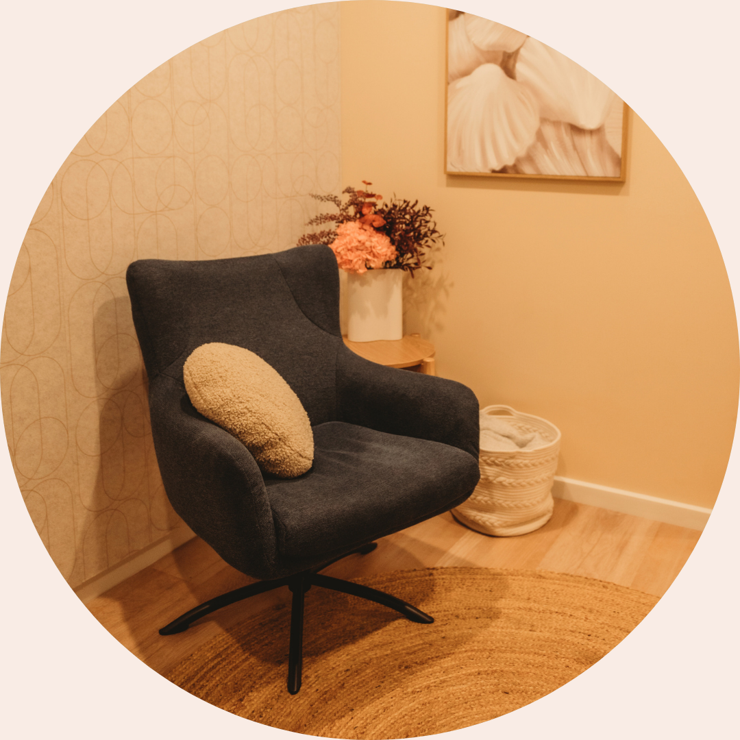 Comfortable counselling room at Fundamental Health designed for telehealth and in-person therapy sessions, with warm lighting and a relaxing armchair.