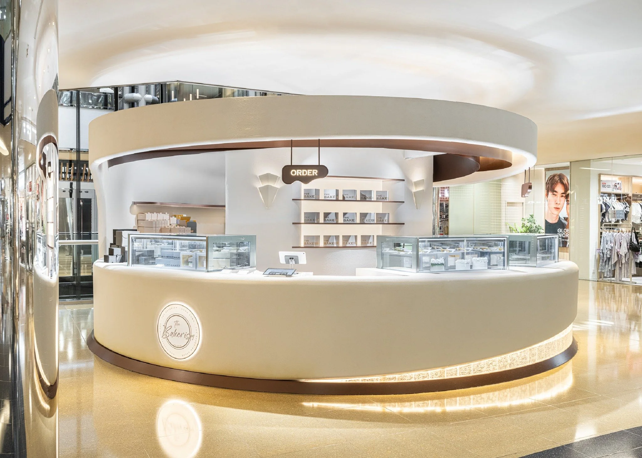 Inspired by Hokkaido&rsquo;s springtime, where the thawing snow unveils the earth, the Bakerism pop-up&rsquo;s circular, layered ceiling mirrors both melting snow and the layers of a cream cake. Load-bearing ceiling structures are discreetly integrat