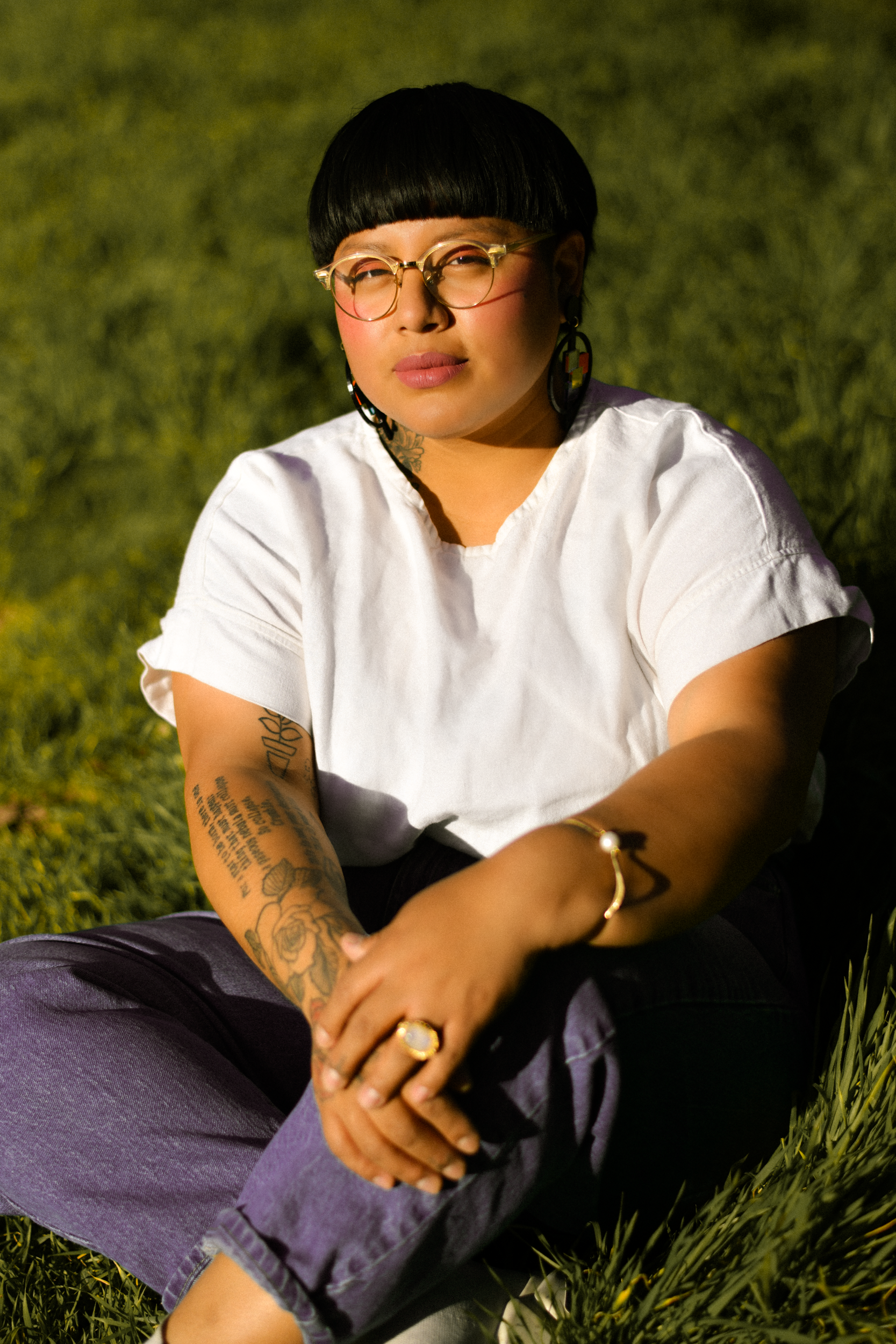 Author portrait of author of "Nostalgia & Borders" and "Somewhere we are Human" Sonia Guiñansaca, captured in Los Angeles by documentary and portrait photographer Gí Tenamá, focusing on presence, voice, and identity.