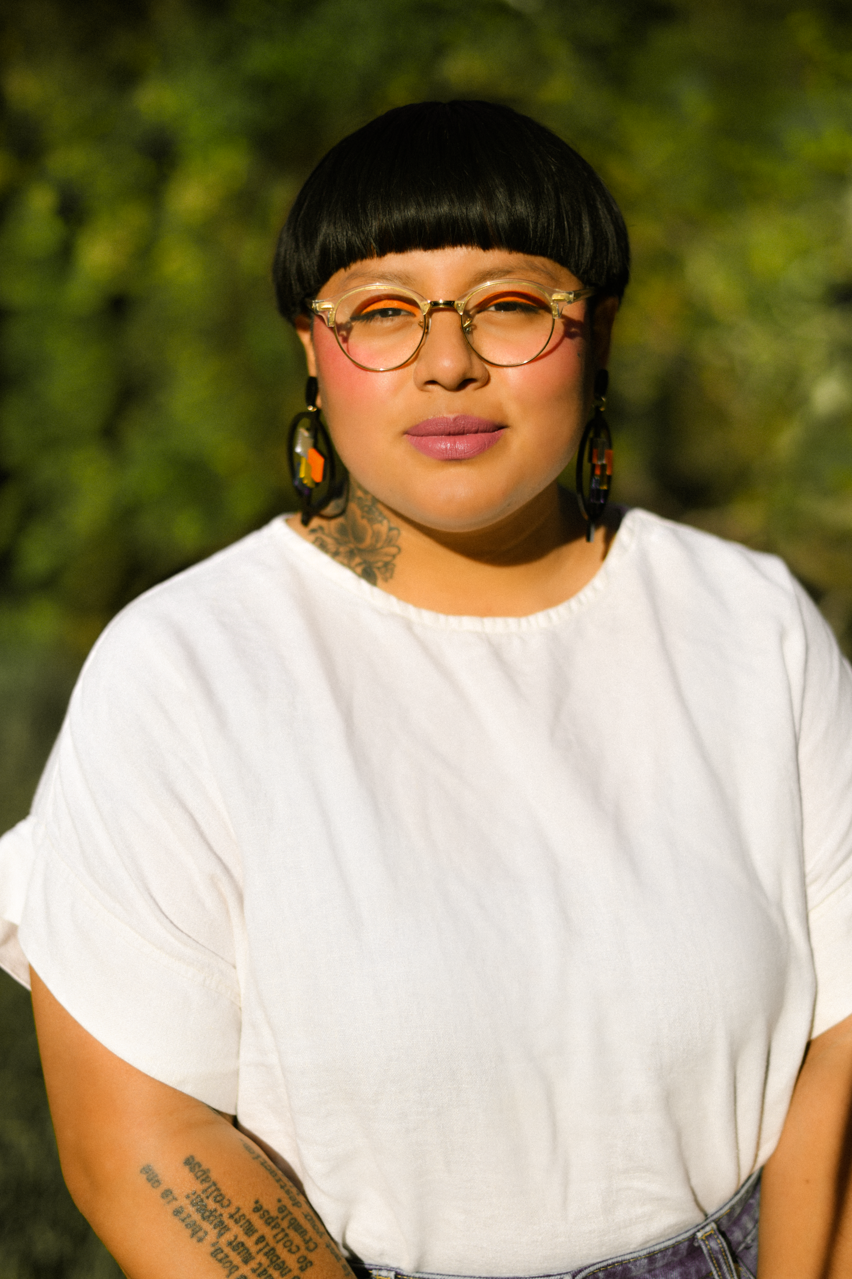 Author portrait of author of "Nostalgia & Borders" and "Somewhere we are Human" Sonia Guiñansaca, captured in Los Angeles by documentary and portrait photographer Gí Tenamá, focusing on presence, voice, and identity.