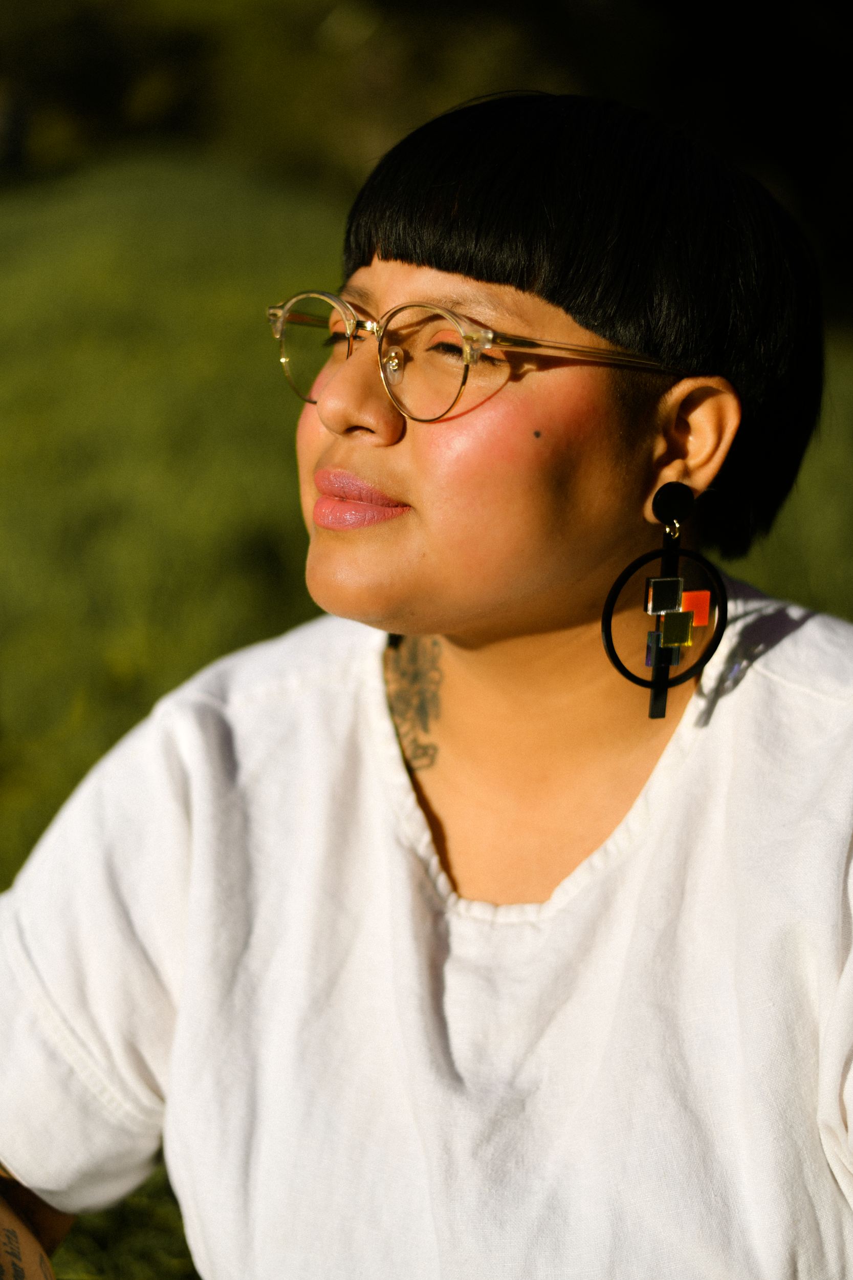 Author portrait of author of "Nostalgia & Borders" and "Somewhere we are Human" Sonia Guiñansaca, captured in Los Angeles by documentary and portrait photographer Gí Tenamá, focusing on presence, voice, and identity.