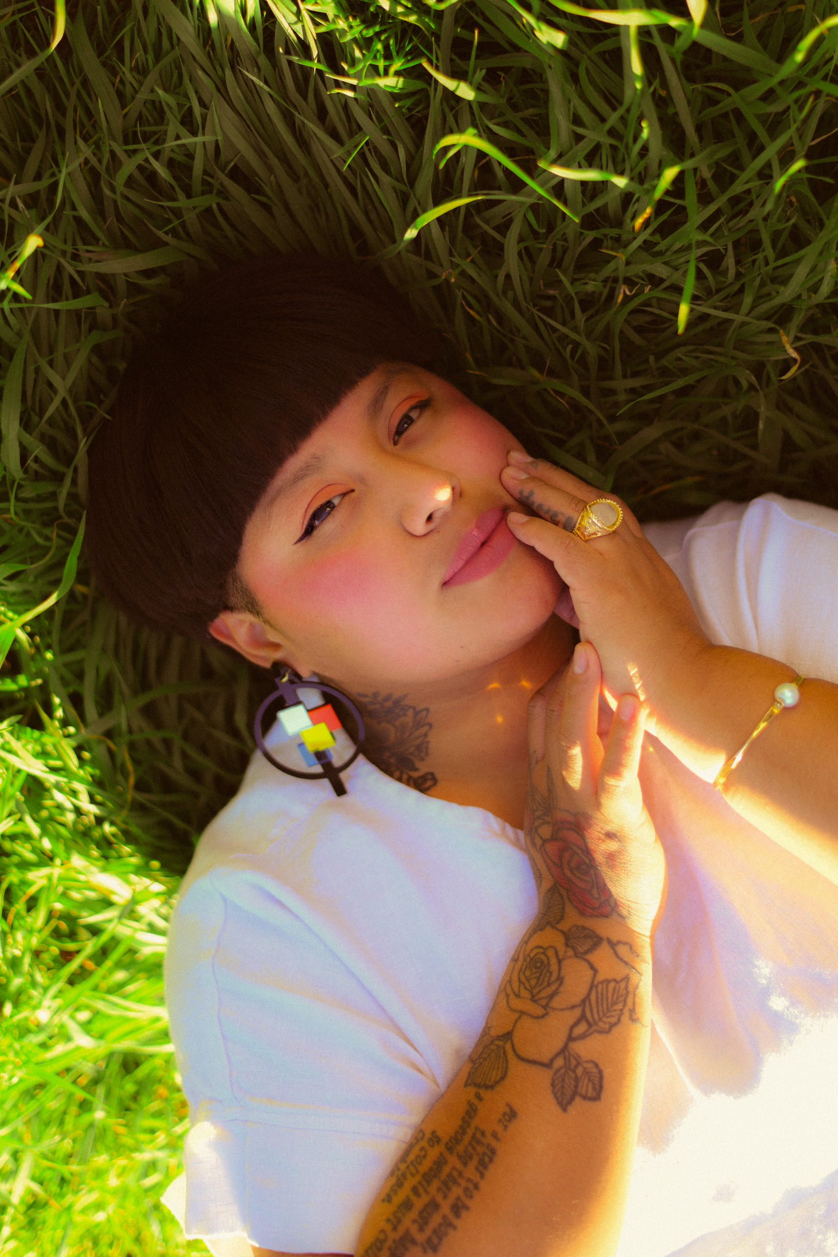 Author portrait of author of "Nostalgia & Borders" and "Somewhere we are Human" Sonia Guiñansaca, captured in Los Angeles by documentary and portrait photographer Gí Tenamá, focusing on presence, voice, and identity.