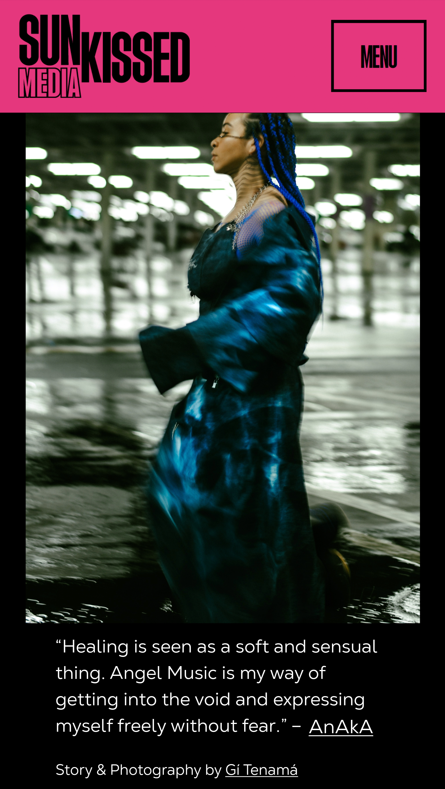 A woman with blue braids dancing in an industrial parking garage during the filming of a music video for AnAkA. Published on Sun-kissed Media.