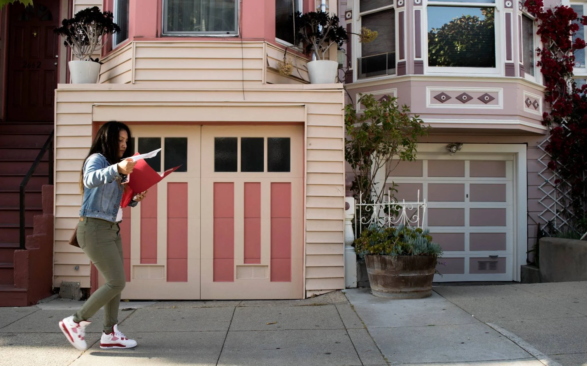 Youth activist Rocio Navarro walks near her old neighborhood in the Mission District on May 18, 2016. Navarro and her family moved to the Bayview for more affordable rent after their rent went up last year.
