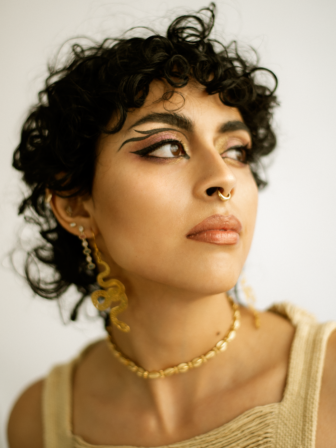 Los Angeles-based fashion editorial portrait photographer documenting style as self-expression, movement, and visual identity for a jewelry campaign, featuring a Latina model