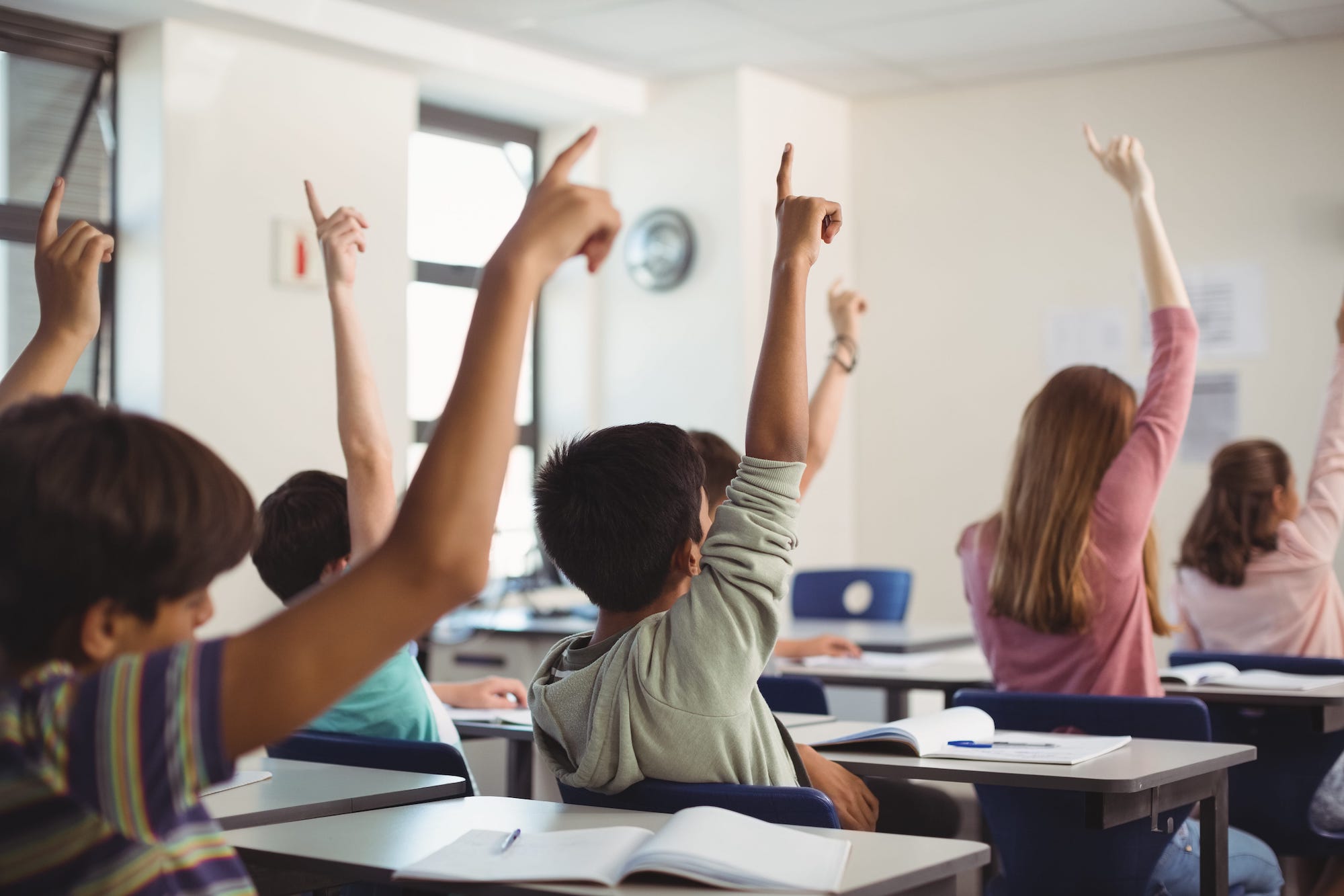 school-kids-raising-hand-in-classroom-PKP4687-min.jpeg