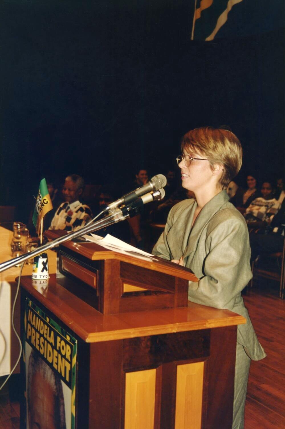 Speaking at a town hall meeting