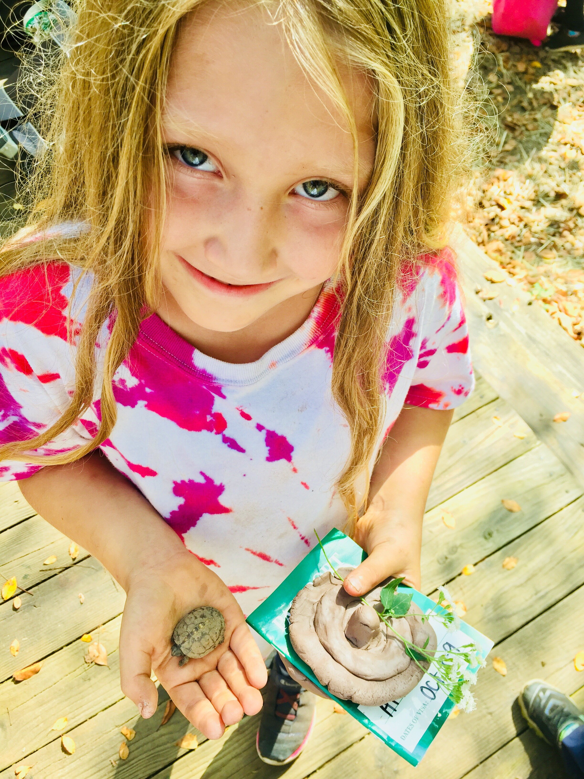 Girl w clay and turtle.jpeg