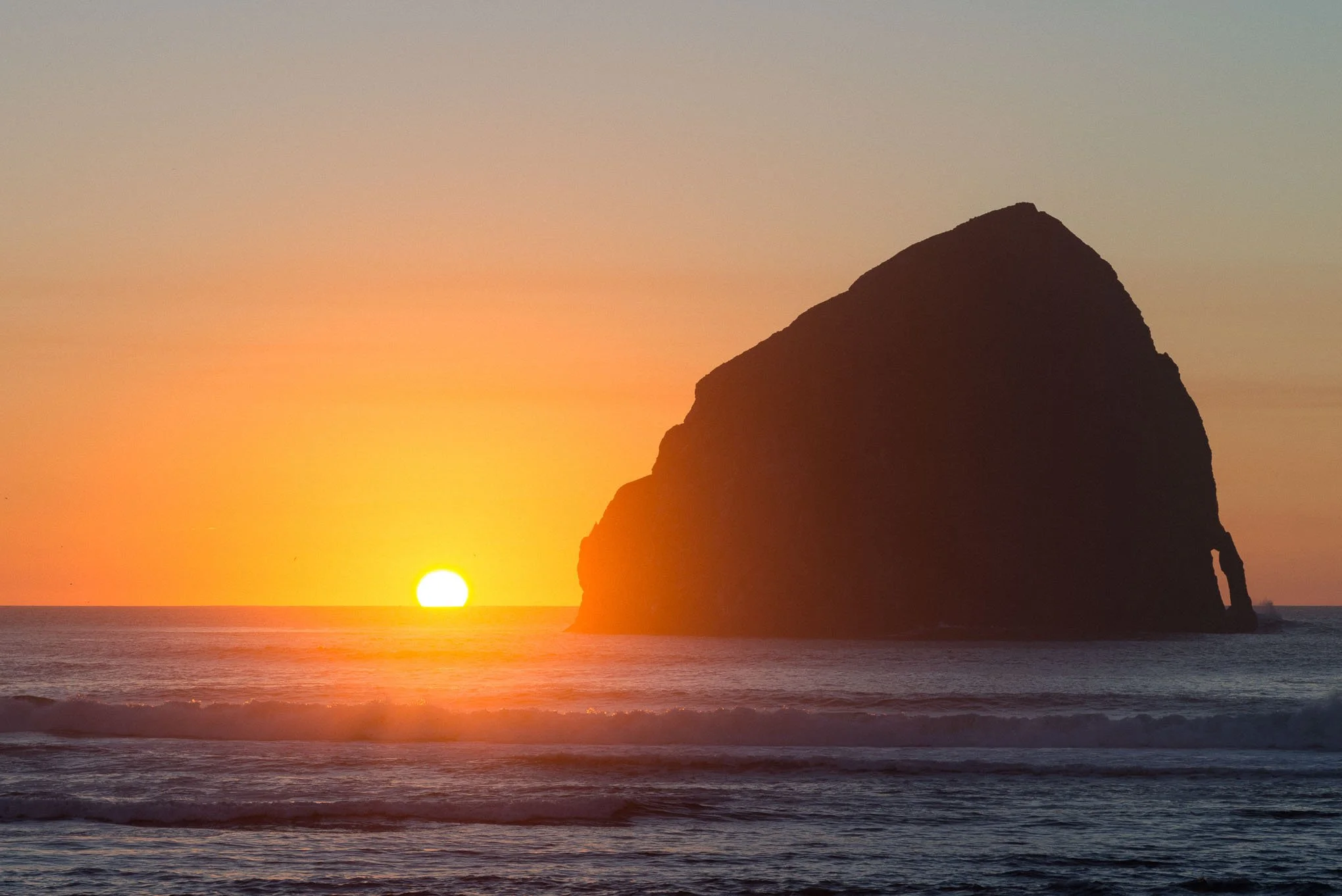 kiwanda-sunset-haystack-rock-pacific-city-oregon-coast-ocean-sun-reflection-landscape-photography-brendan-alex-phoenix.jpg