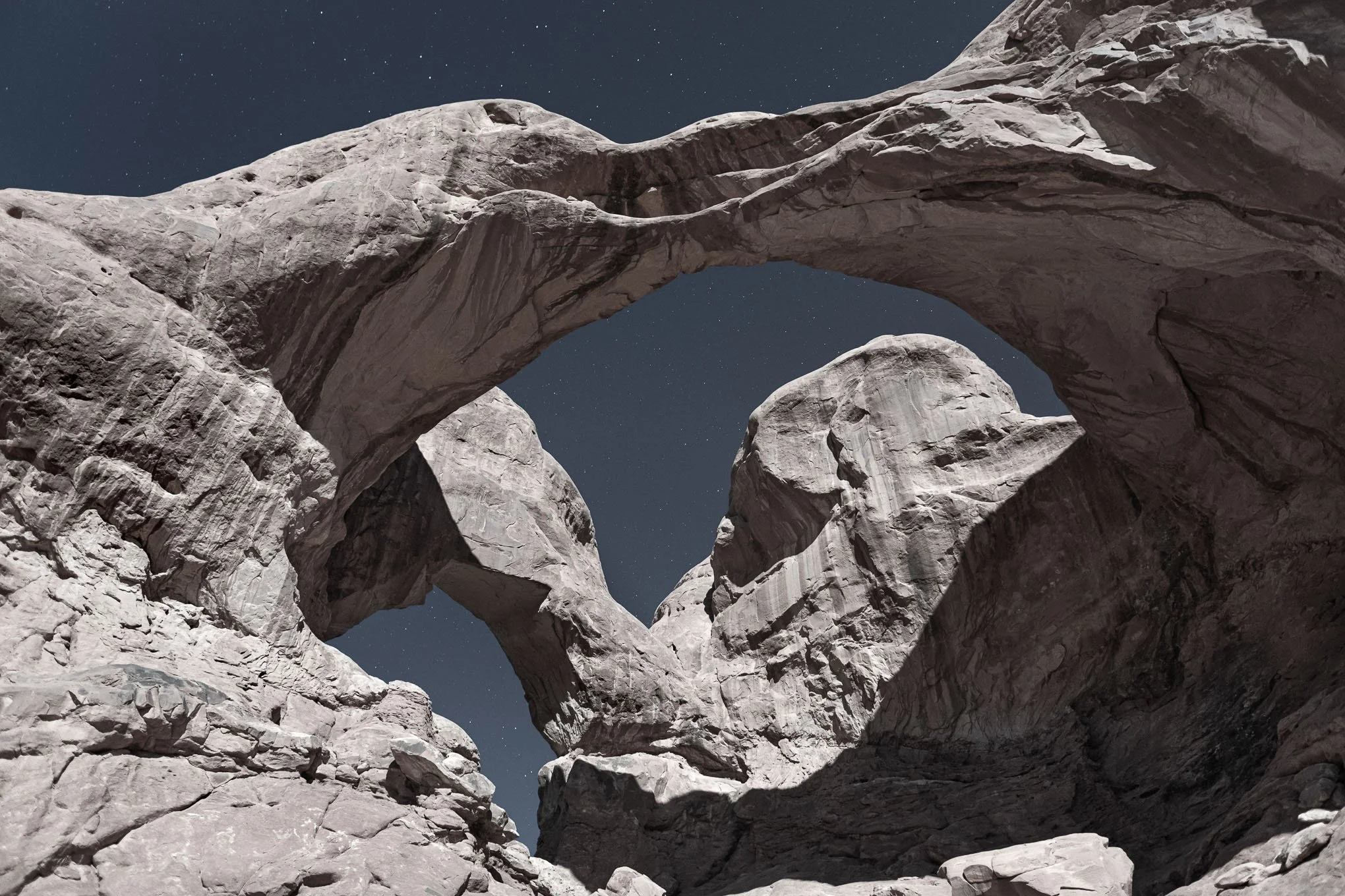 moonlight-double-arch-night-sky-arches-national-park-utah-sandstone-rock-formations-starry-desert-landscape-photography-brendan-alex-phoenix.jpg
