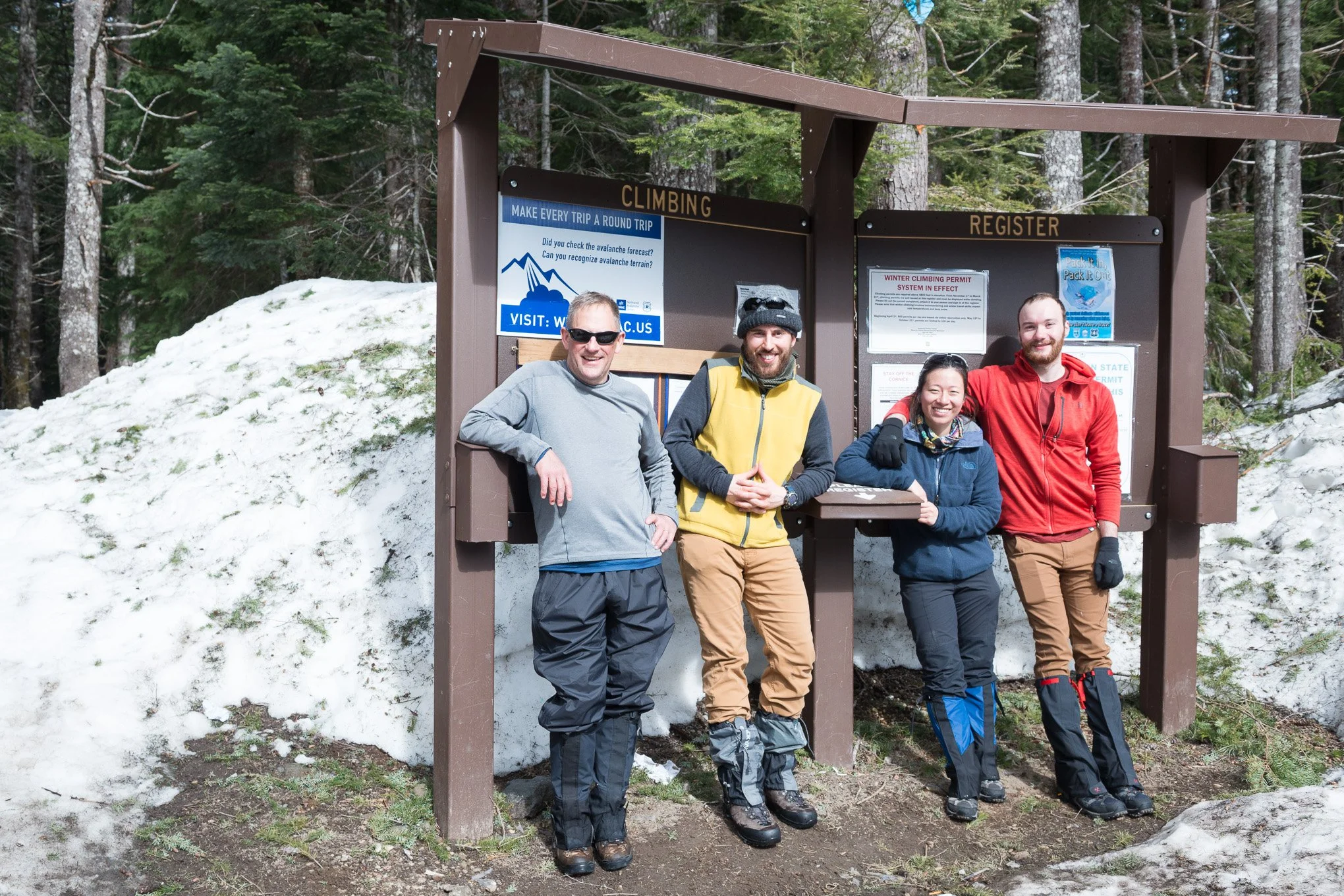 Brendan Alex Phoenix and three fellow hikers stand in winter gear at the Mt. St. Helens climbing register at Marble Mountain Sno-Park.