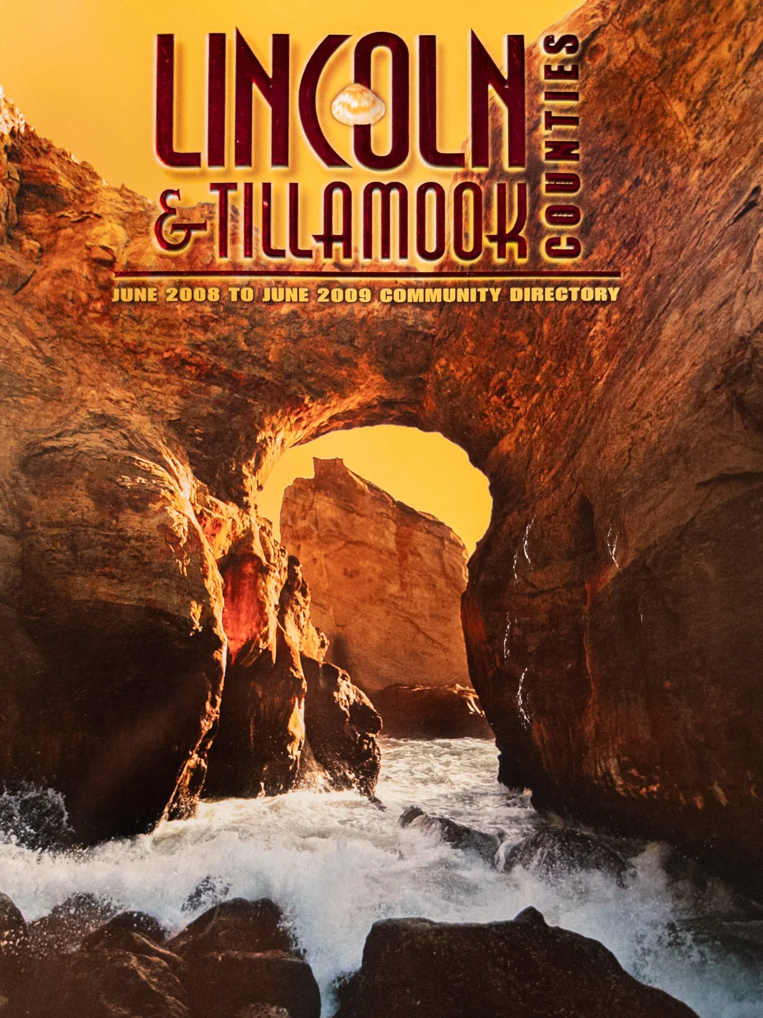 Cover of the 2008–2009 Oregon community directory for Lincoln and Tillamook Counties, featuring a sandstone arch at Cape Kiwanda.