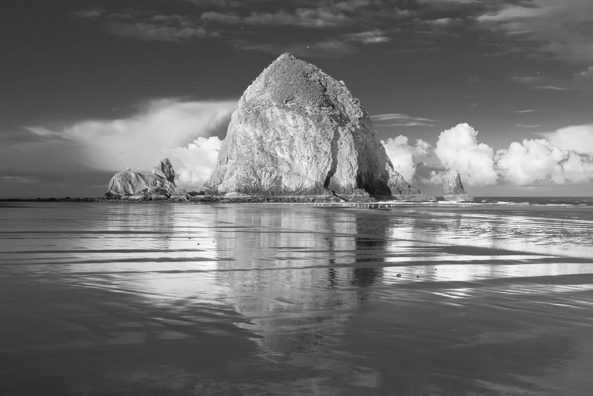 reflections-black-and-white-sunrise-haystack-rock-low-tide-cannon-beach-oregon-landscape-photography-brendan-alex-phoenix.jpg