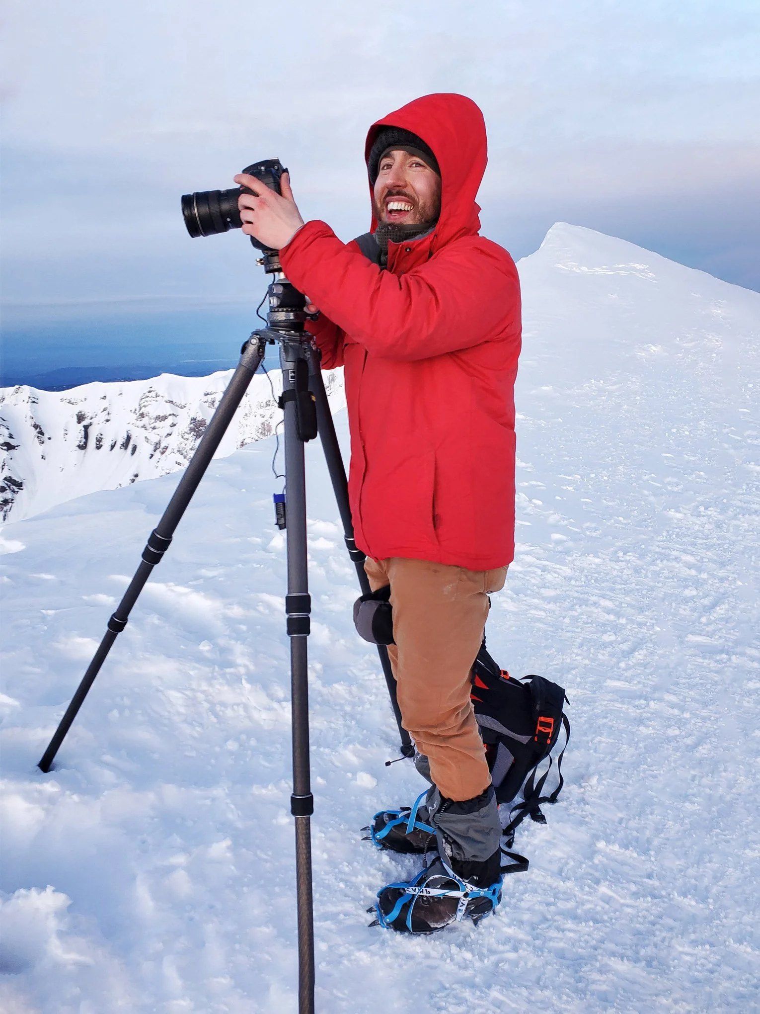 Landscape photographer Brendan Alex Phoenix on Mt. St. Helens during a winter field photography expedition, highlighting the dedication behind his artwork.