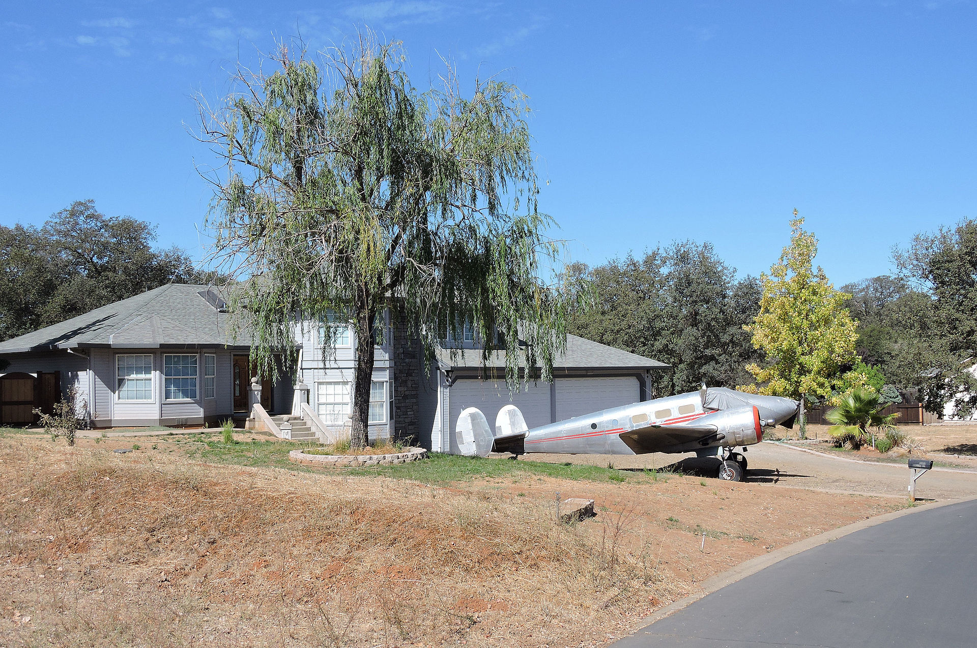 1920px-Cameron_Airpark_plane_in_driveway2.jpg