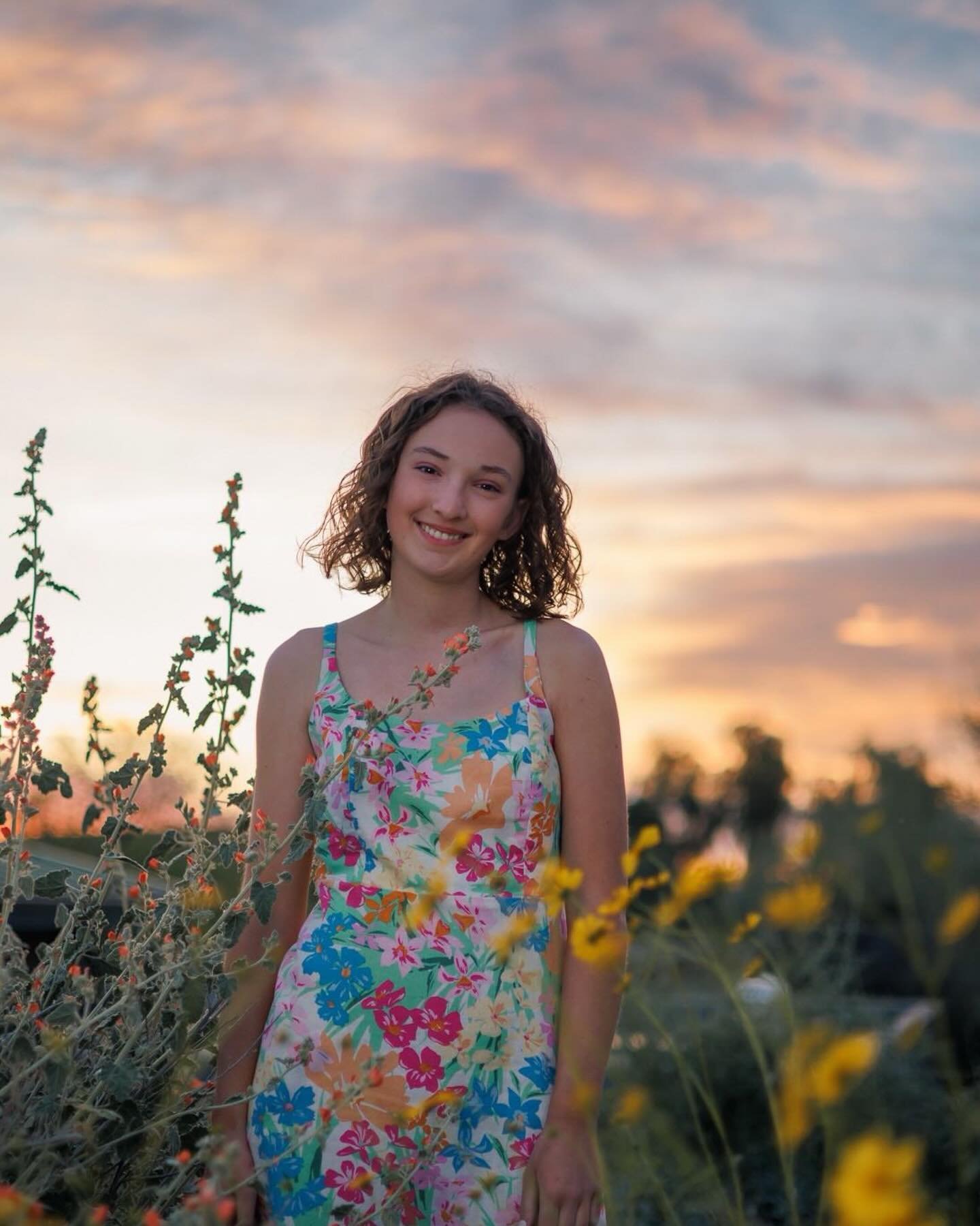 We started this session with the very high possibility of rain, the skies were dark blue but we decided to risk it and went ahead with the session, and wow was I glad we did because we had a gorgeous sunset and the colors matched perfectly her beauti