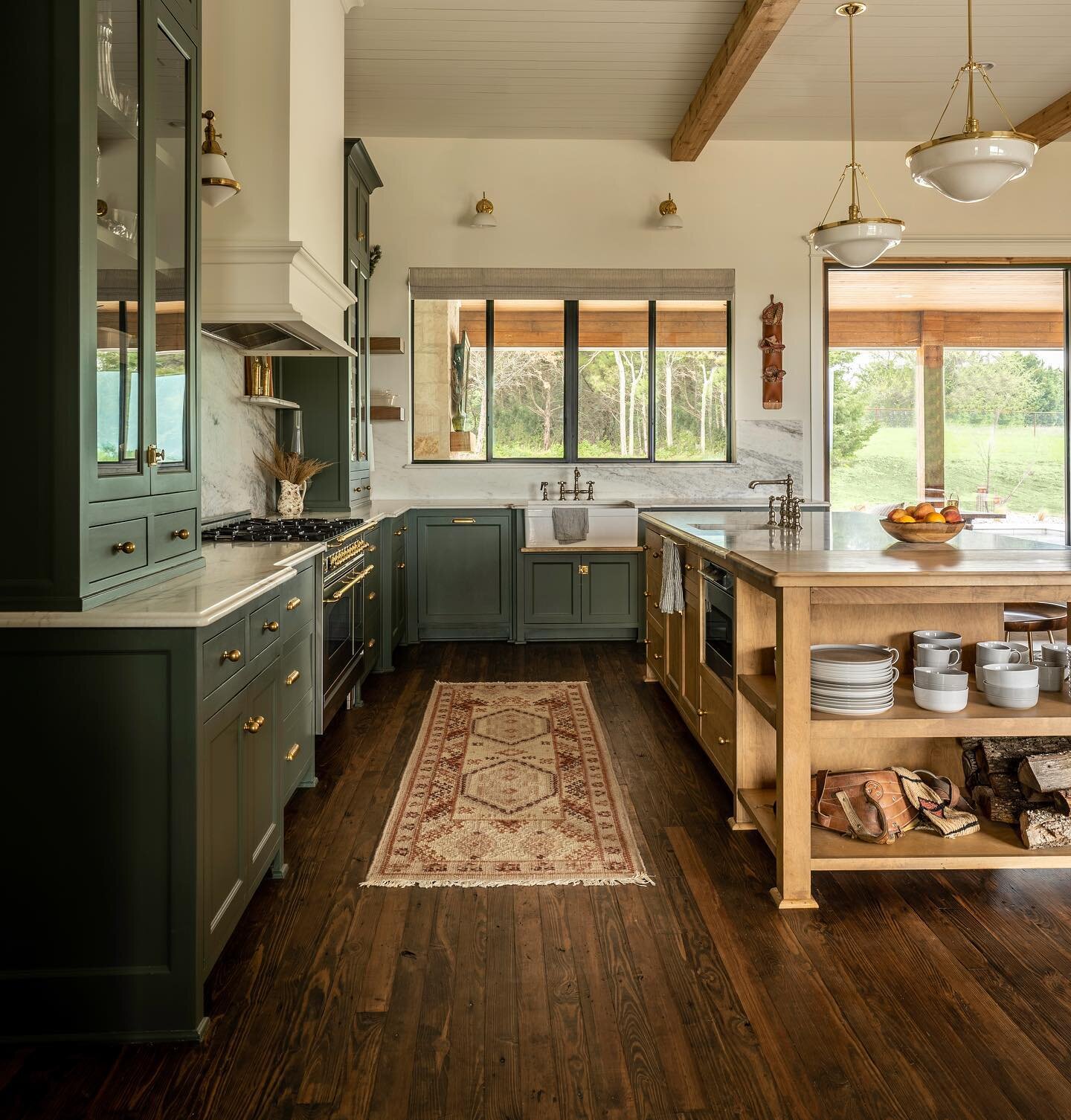 This Kitchen is what Texas dreams are made of:
- beautiful &amp; cohesive color palette 
- natural light w greenbelt views
- separate space just adjacent for pantry, refrigerator, wet bar and office 
- marble slab backsplash
- two sinks
- 48&rdquo; d