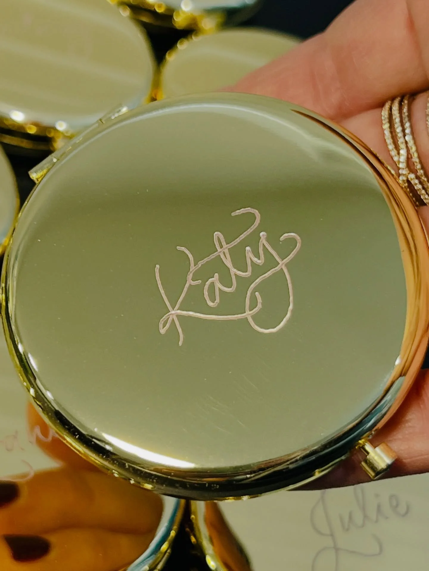 The cutest gift that everyone actually keeps ✨

My hand-engraved compact mirrors in all the styles&mdash;classic round, black Chanel, MacKenzie-Childs check and more. Names go on the mirror or cover. Your options are endless!

Perfect for bridesmaids