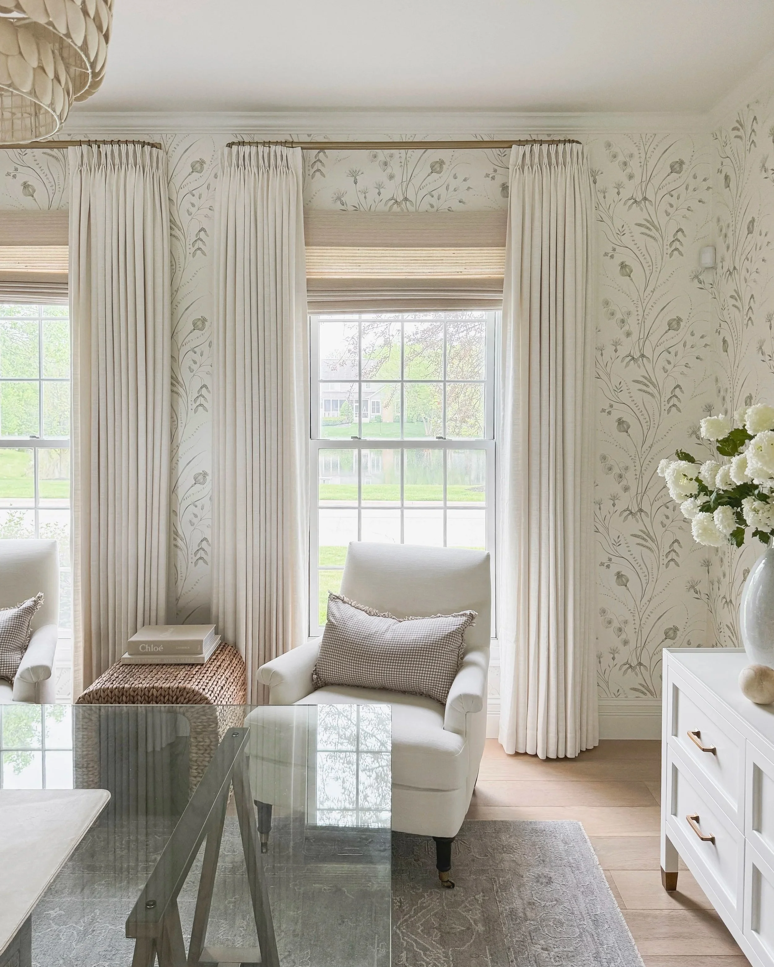 Curtain rod mounted close to ceiling with floor-length TwoPages panels in a neutral bedroom