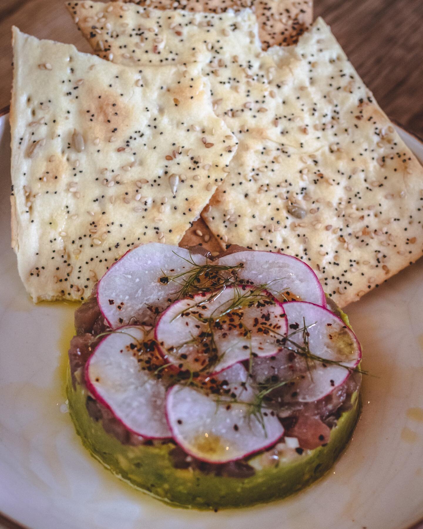 Looking for a refreshing afternoon snack?? Tuna Tartare with @noblebread lavash is the perfect item from our raw bar!