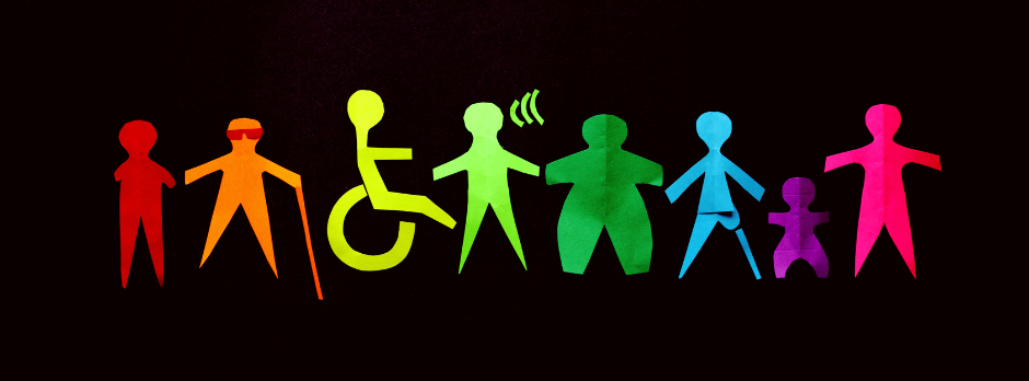 Colorful paper cutouts representing diverse individuals, including those with disabilities, standing in a row on a black background.