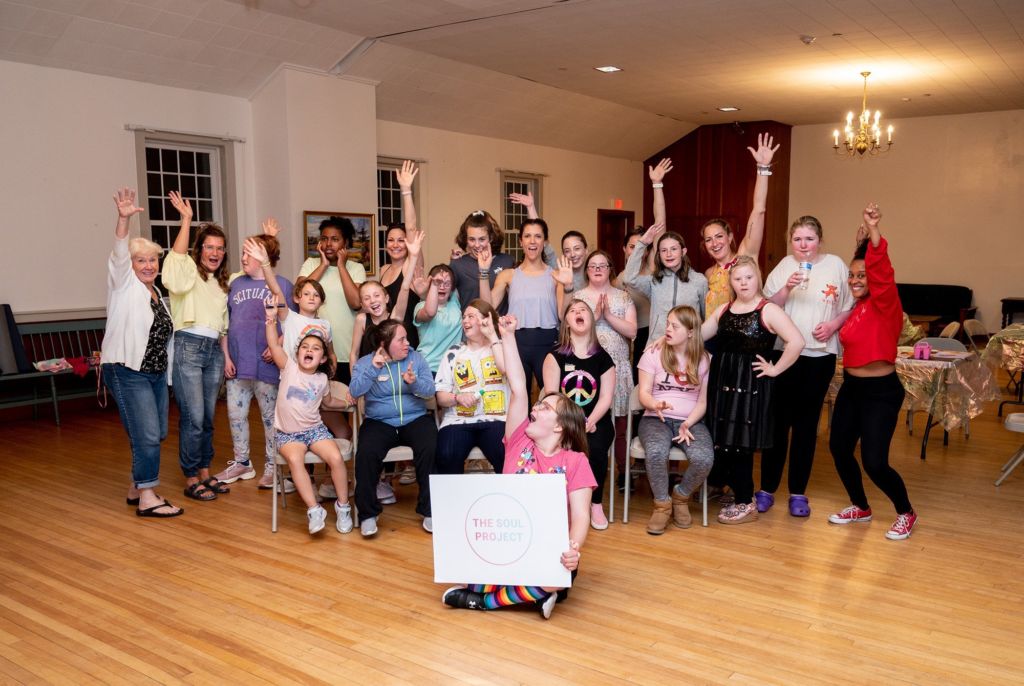 Group of girls with developmental difficulties celebrating their Club