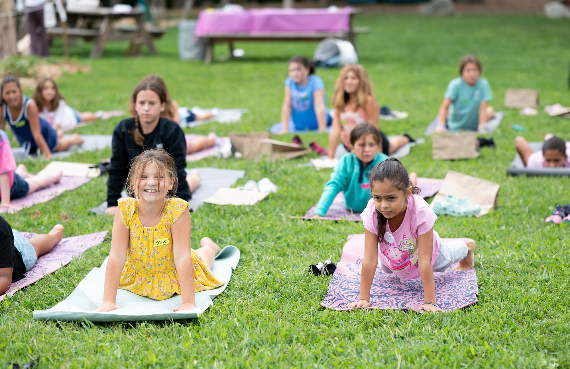 Girls doing yoga in a park 