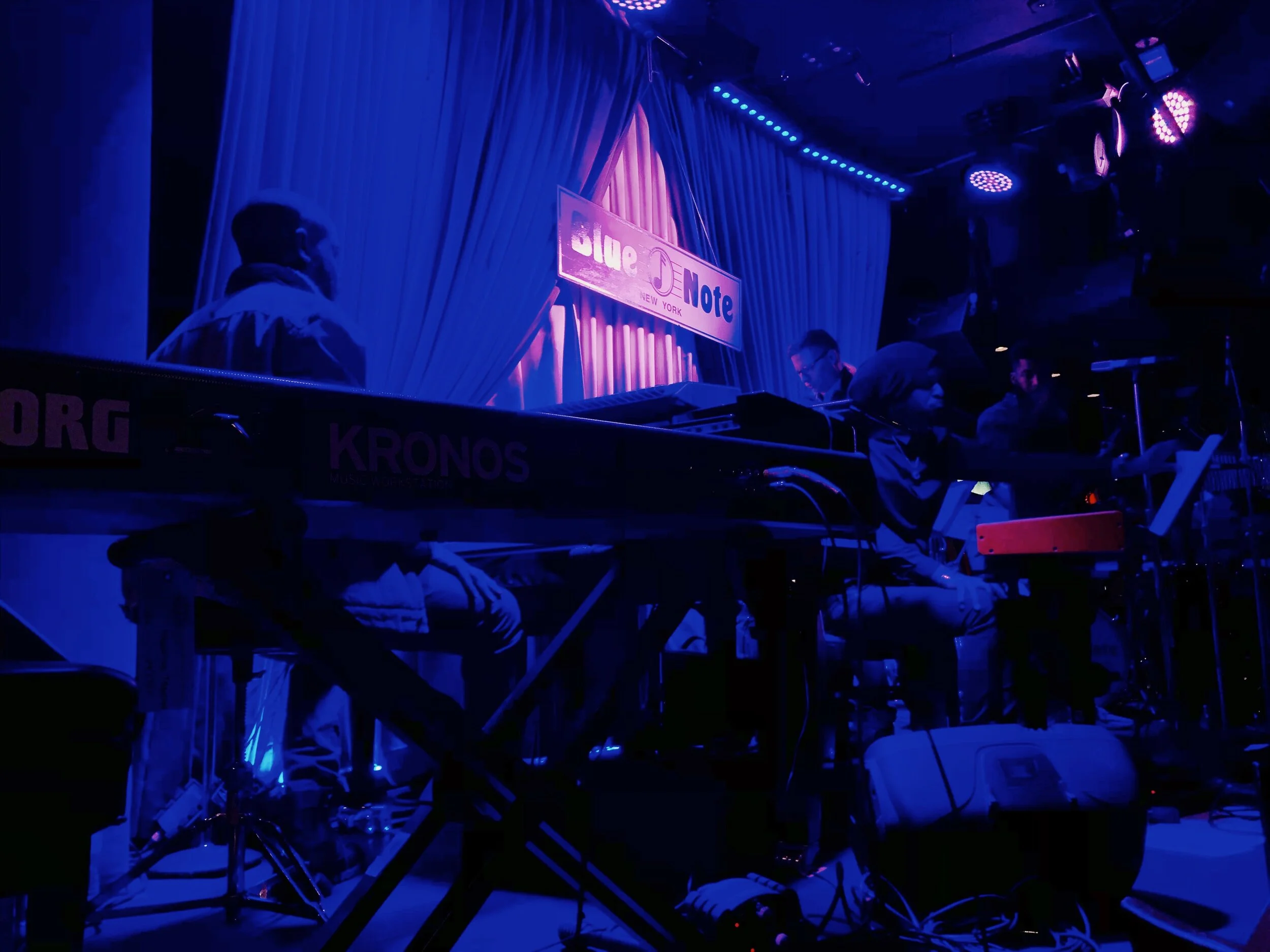 Keyboard performance on a blue-lit stage
