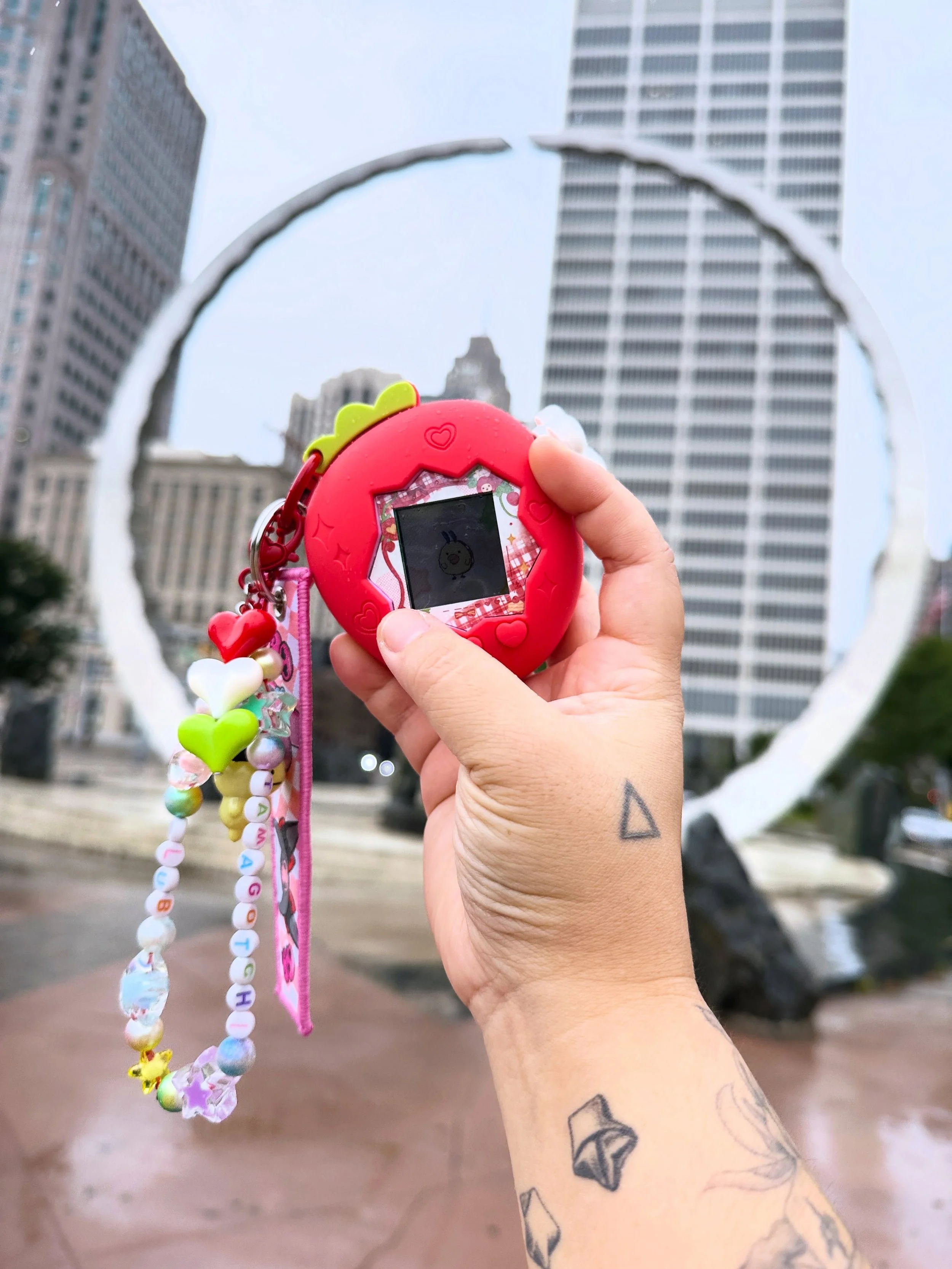 @detroit.tamagotchi.club logo IRL, the monument in Detroit called &ldquo;Transcending&rdquo;, the Michigan Labor Legacy Landmark! New tshirts for the club, almost done with the club banner. Always fun crafts around tamagotchi love. 🥚💖

#TamagotchiC