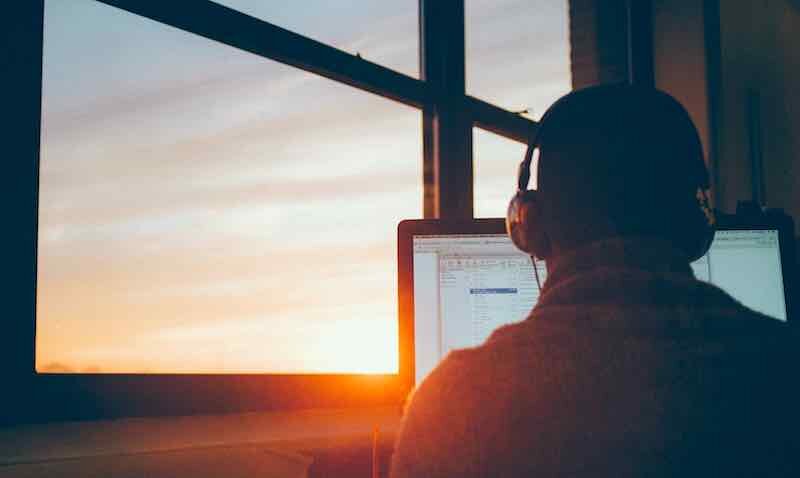 man sunrise computer.jpg