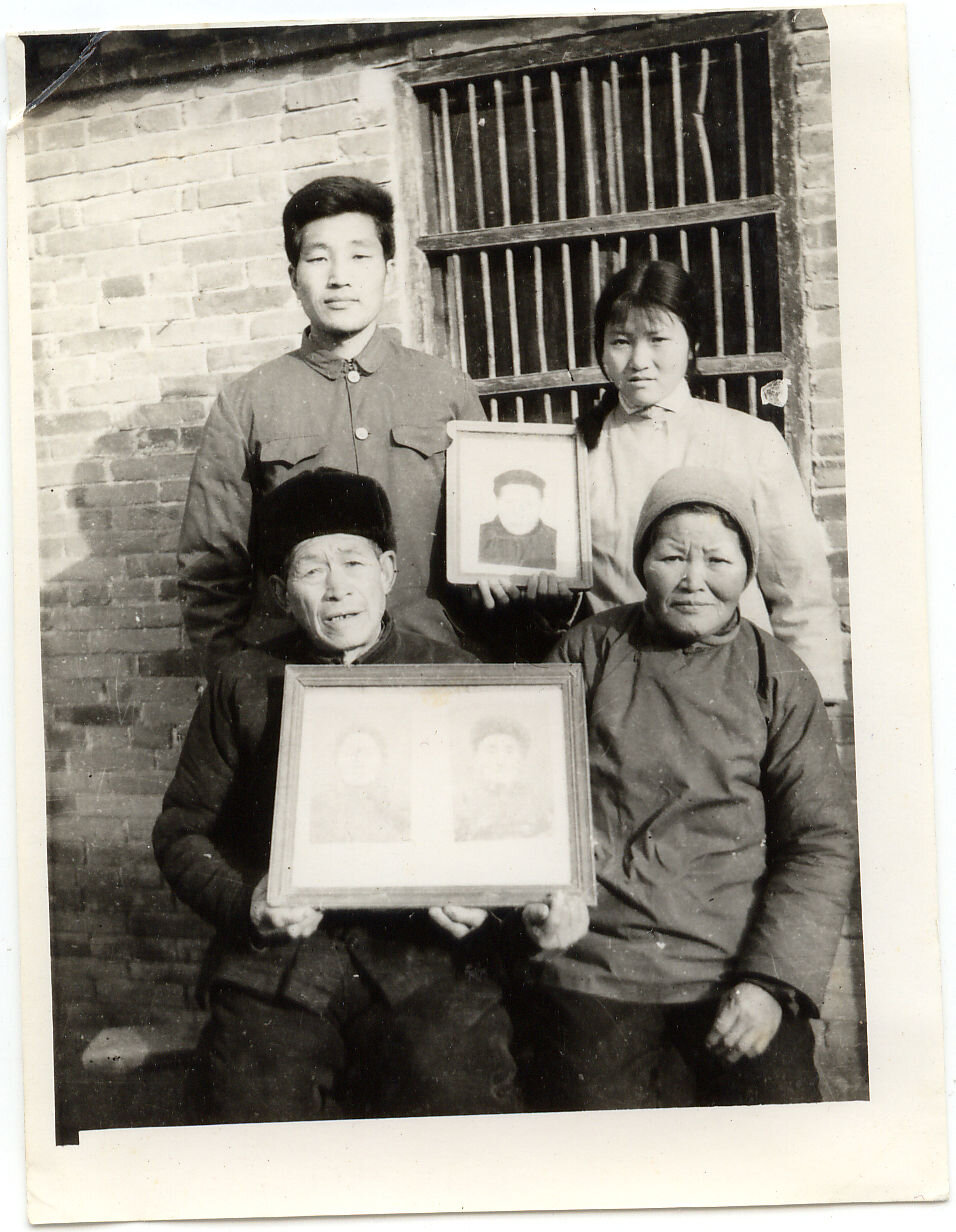  “Book Idiot” Zhou with his mother and father before the Cultural Revolution. During the Cultural Revolution, he was forced to criticize his mother during a “struggle” session. 