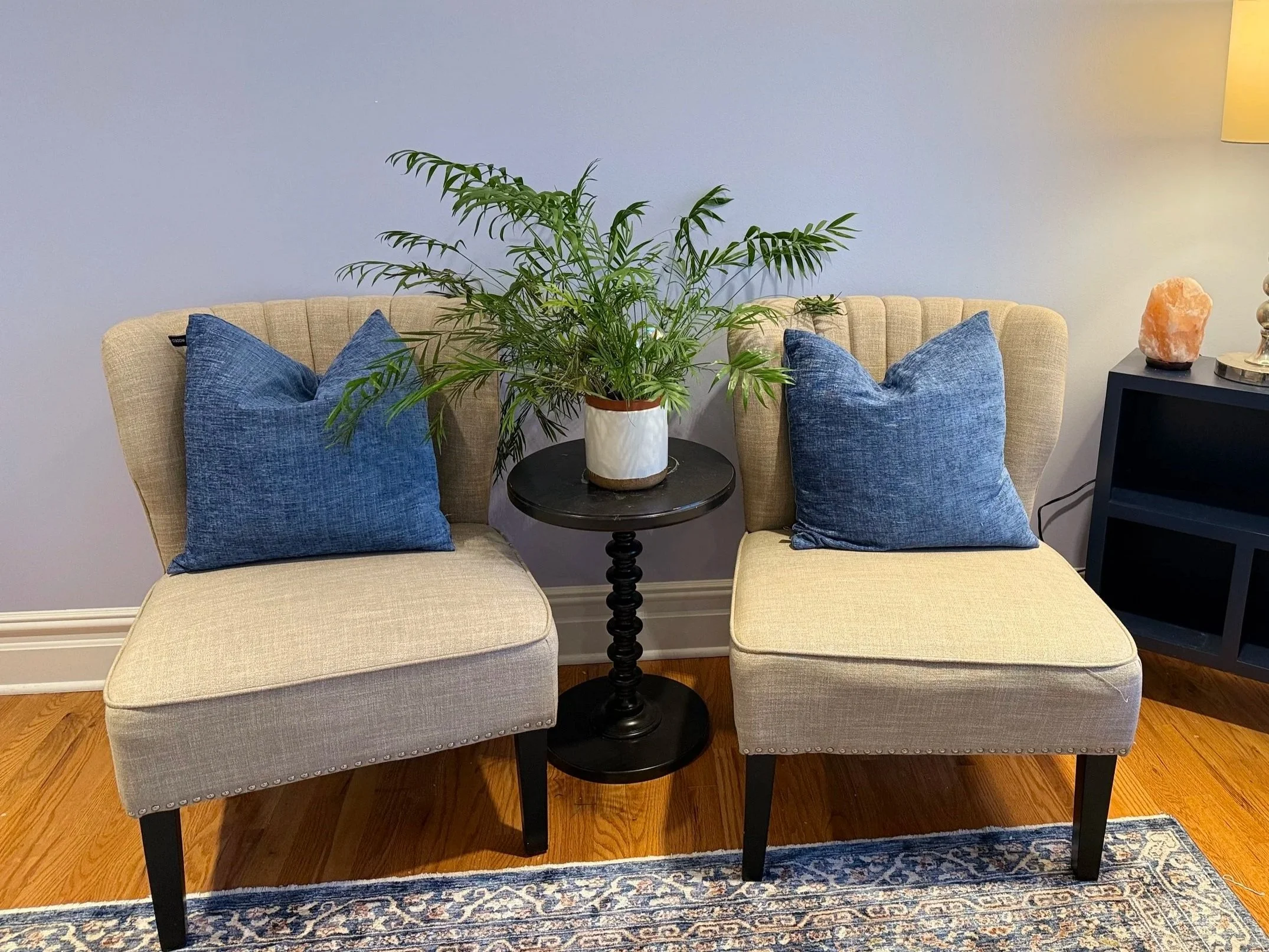 Close-up of therapeutic space with comfortable seating, representing safe, welcoming therapy for new moms and couples